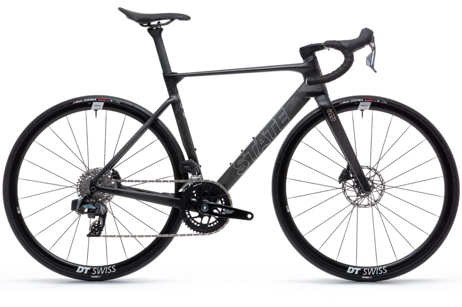 A black Stata gravel or road bicycle with drop handlebars, disc brakes, skinny tires, and a carbon frame.