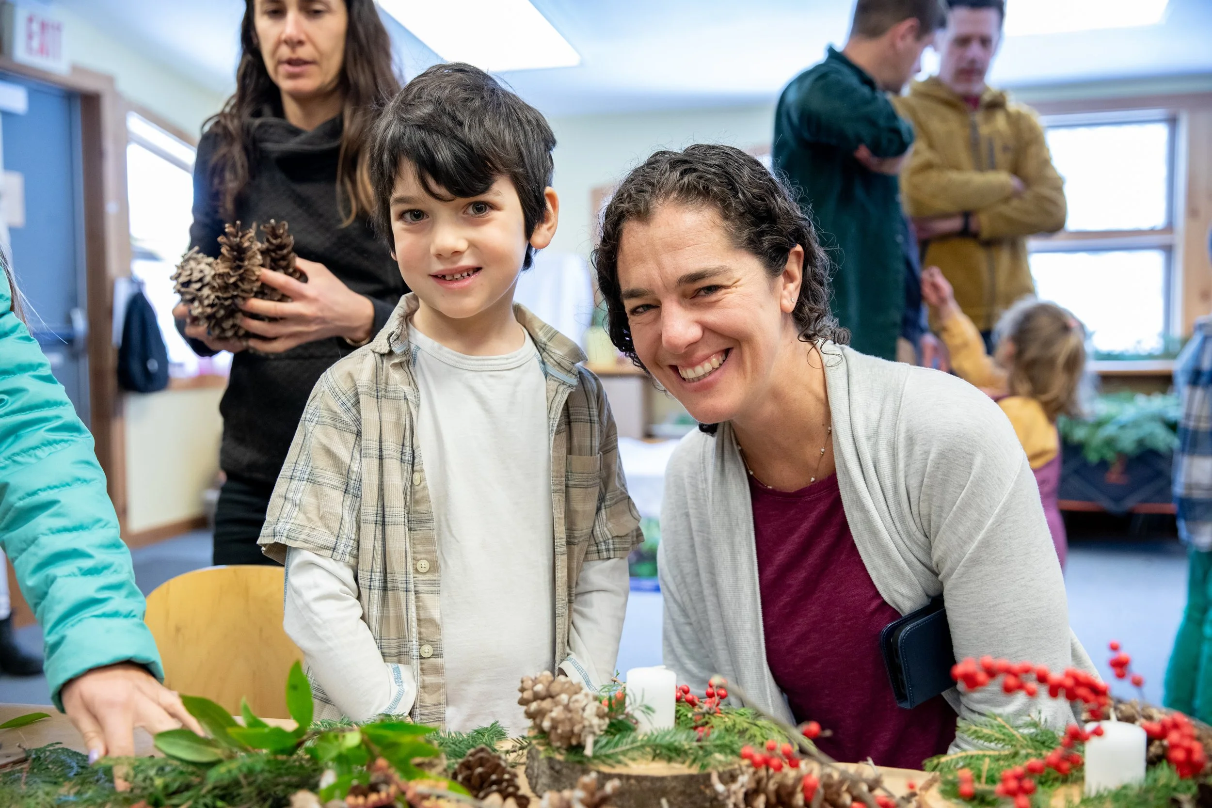 Mother and son smiling at a holiday event