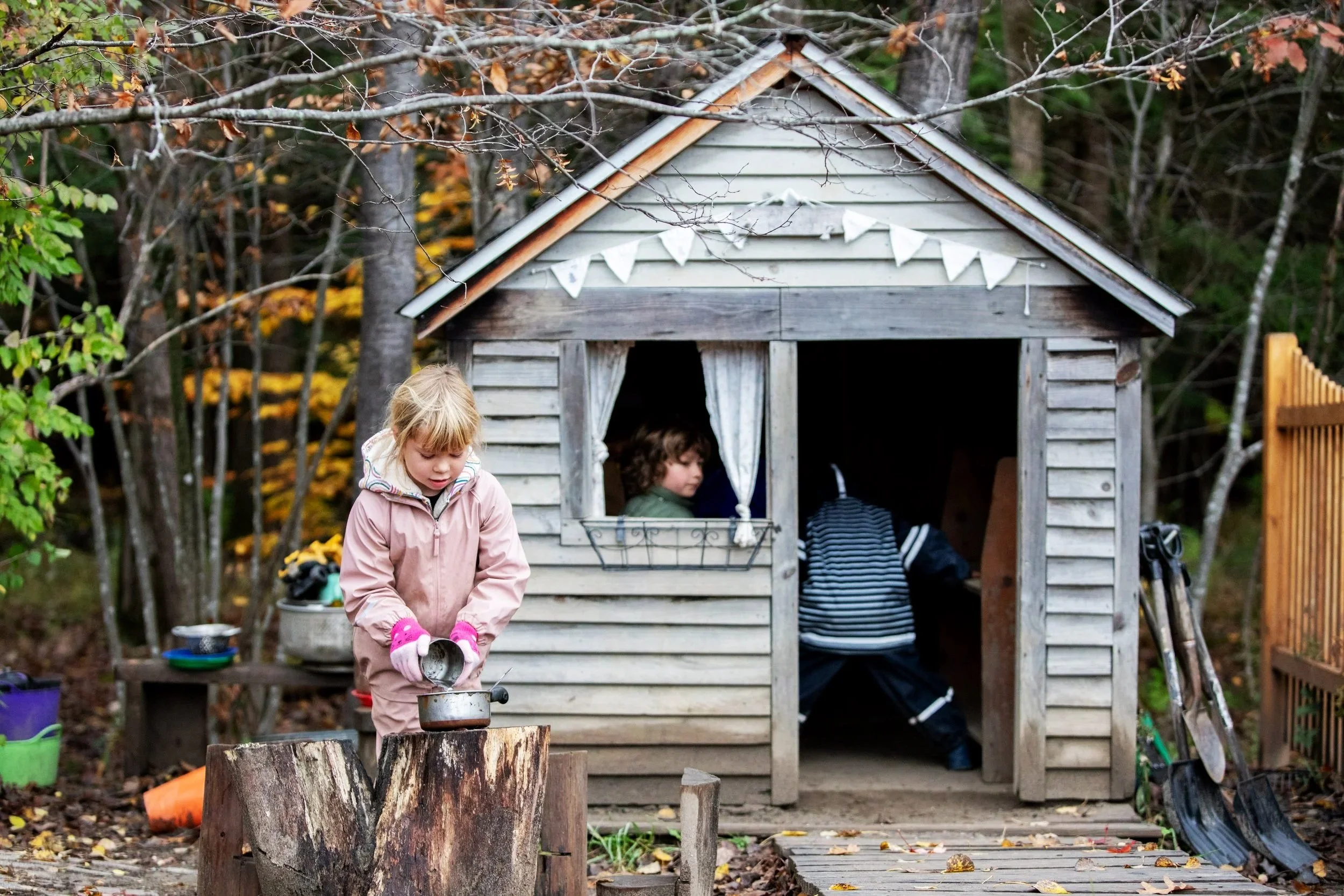 Kindergartners playing outdoors in the autumn