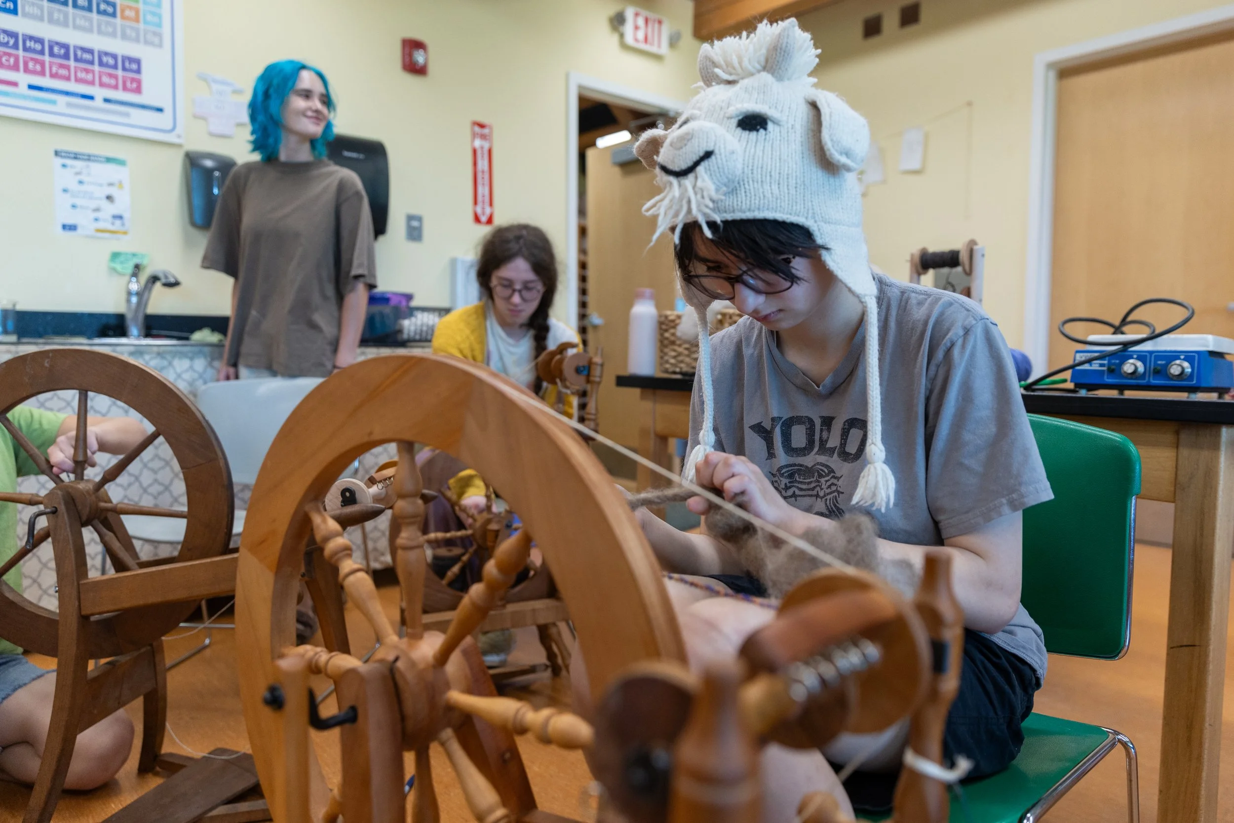 Student spinning wool