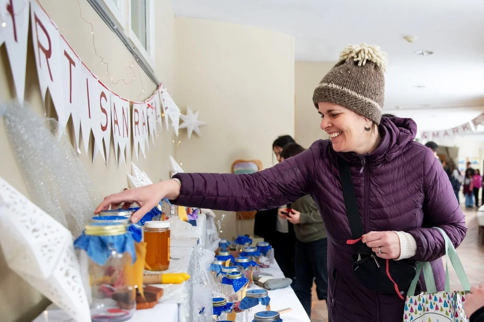 Woman smiling looking at raffle items
