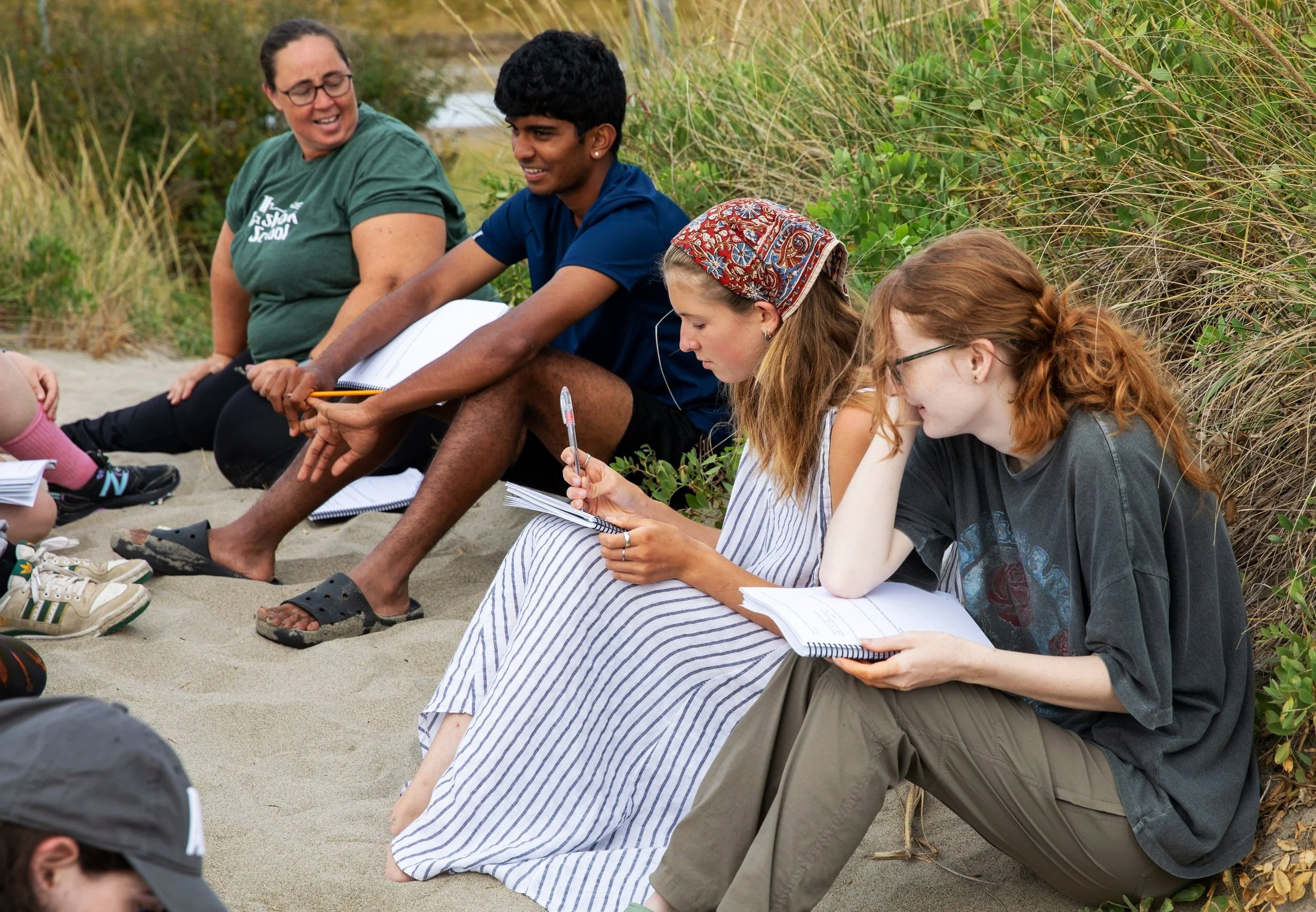Teacher and students having a discussion outside