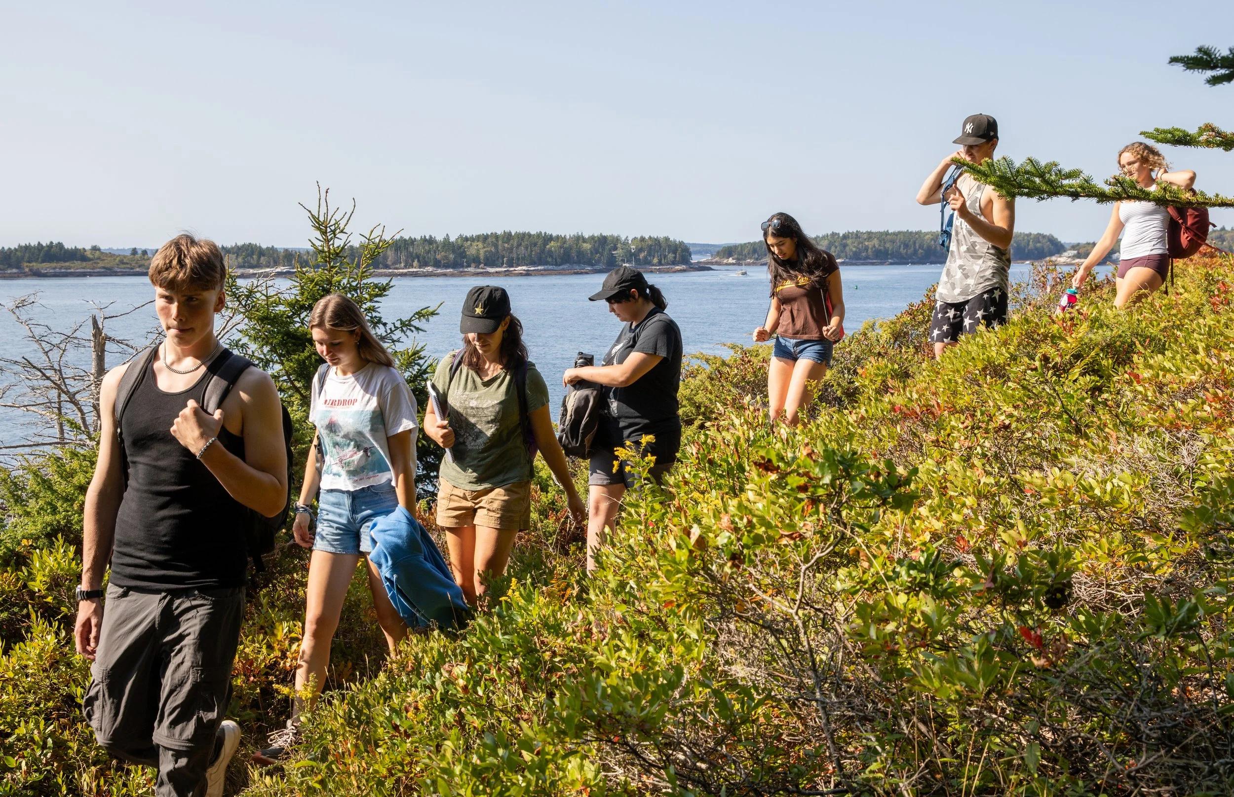 High school students hiking along the coast