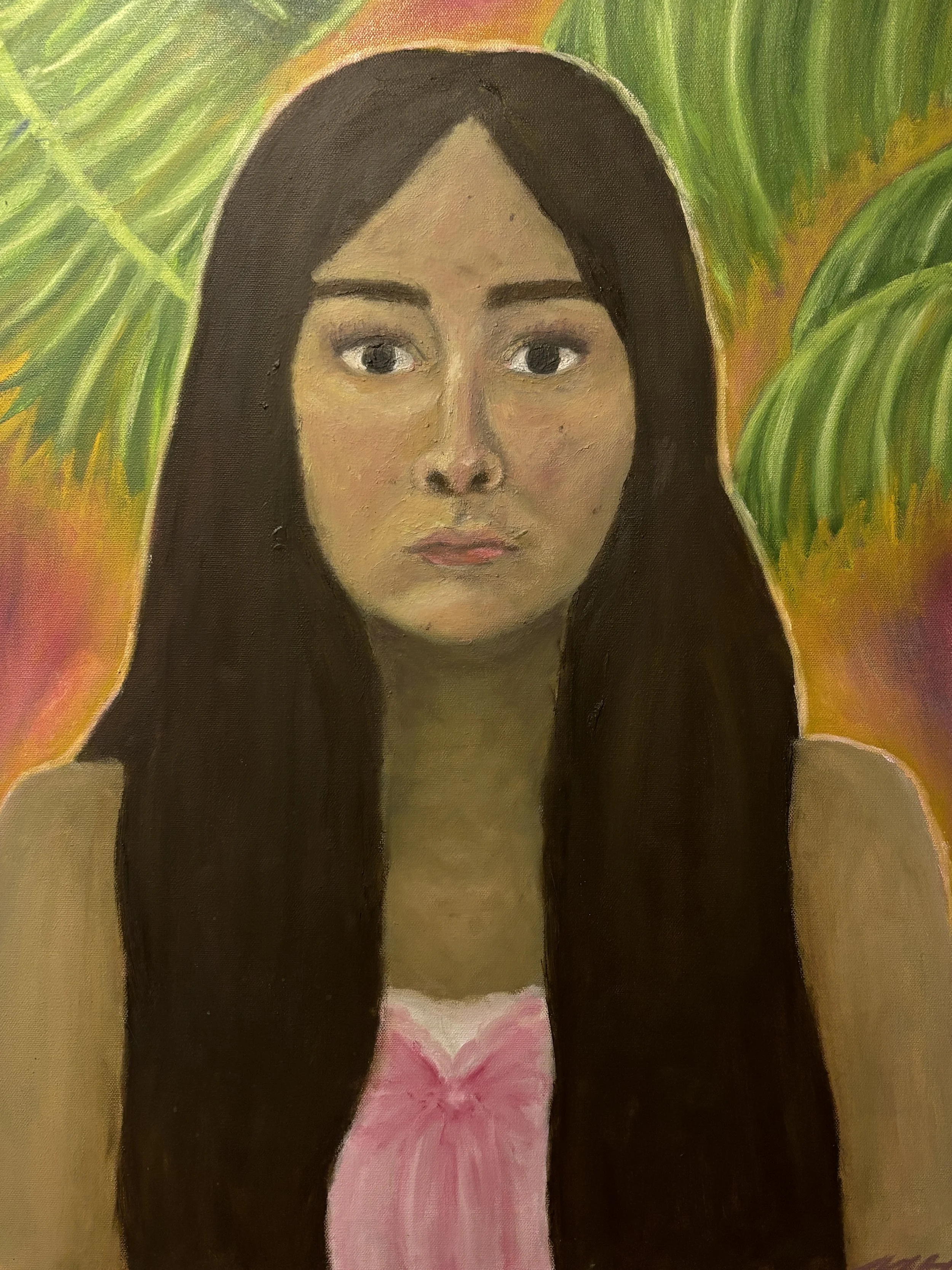 Self-portrait of a girl in front of palm fronds