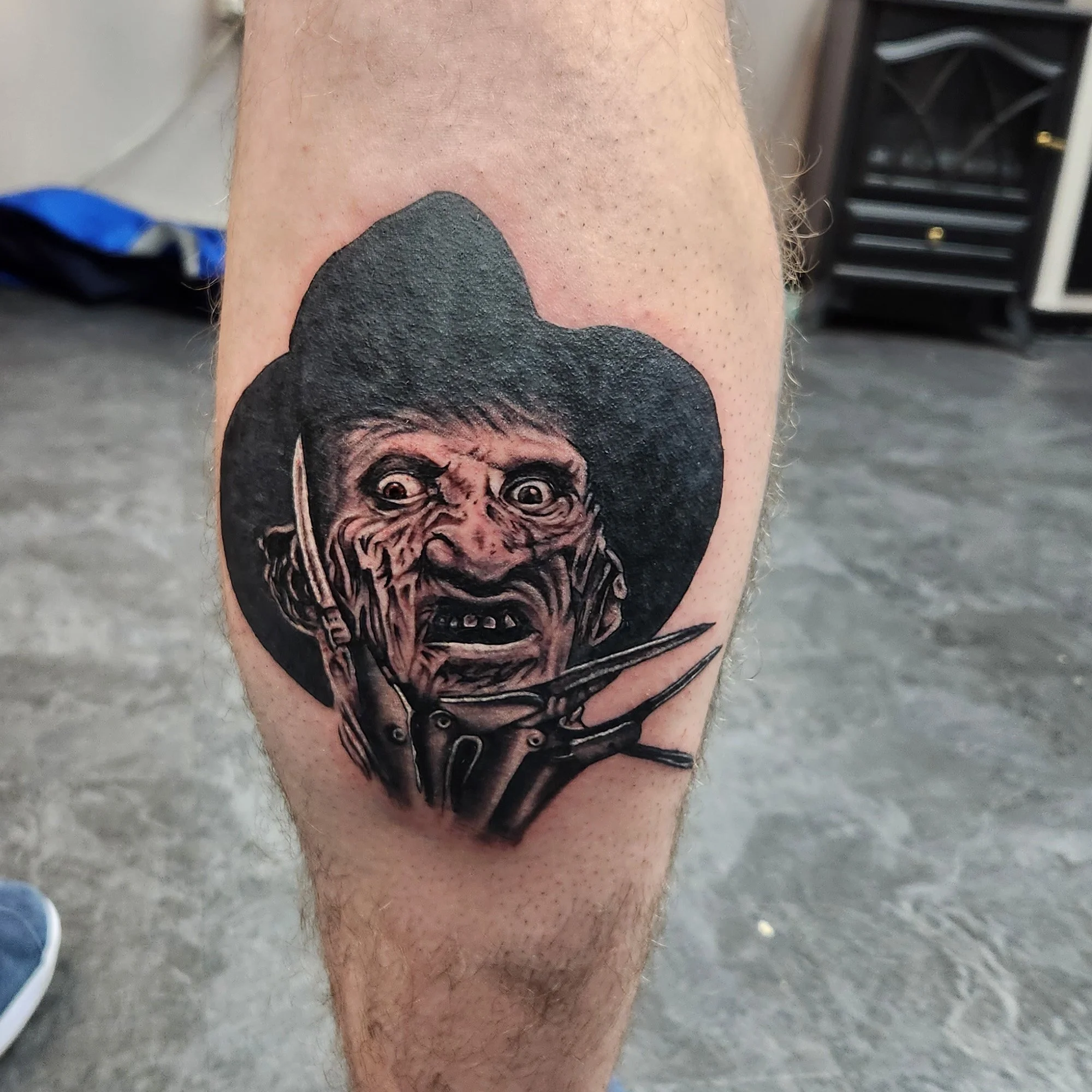 Black and grey portrait of Freddy Krueger