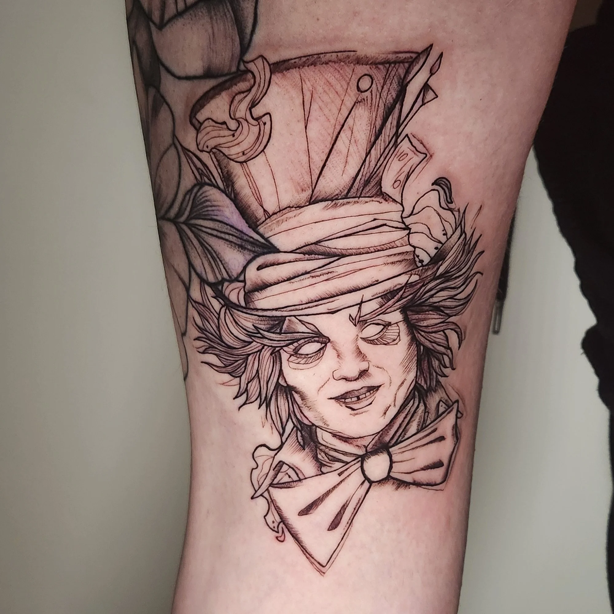 Sketchy tattoo of madhatter.