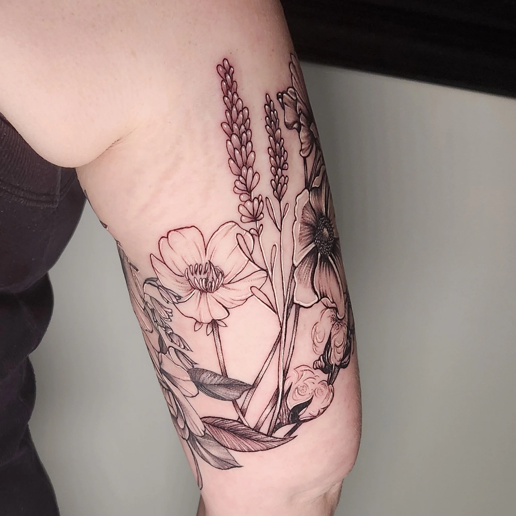 Fine line work of wild flower tattoo
