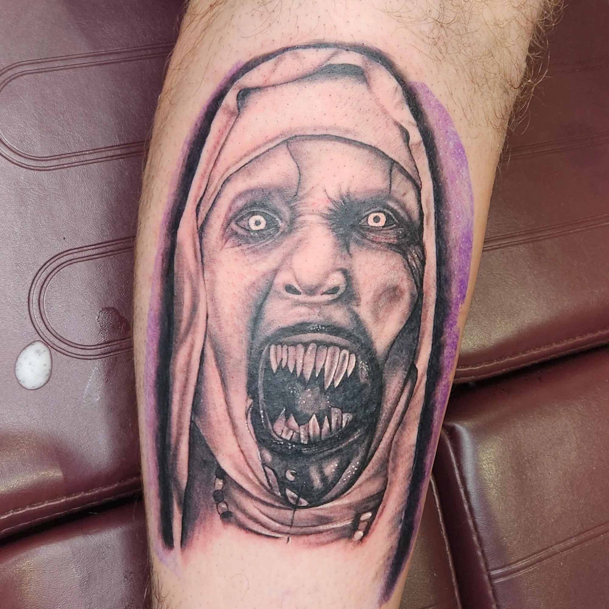 Black and grey horror nun tattoo