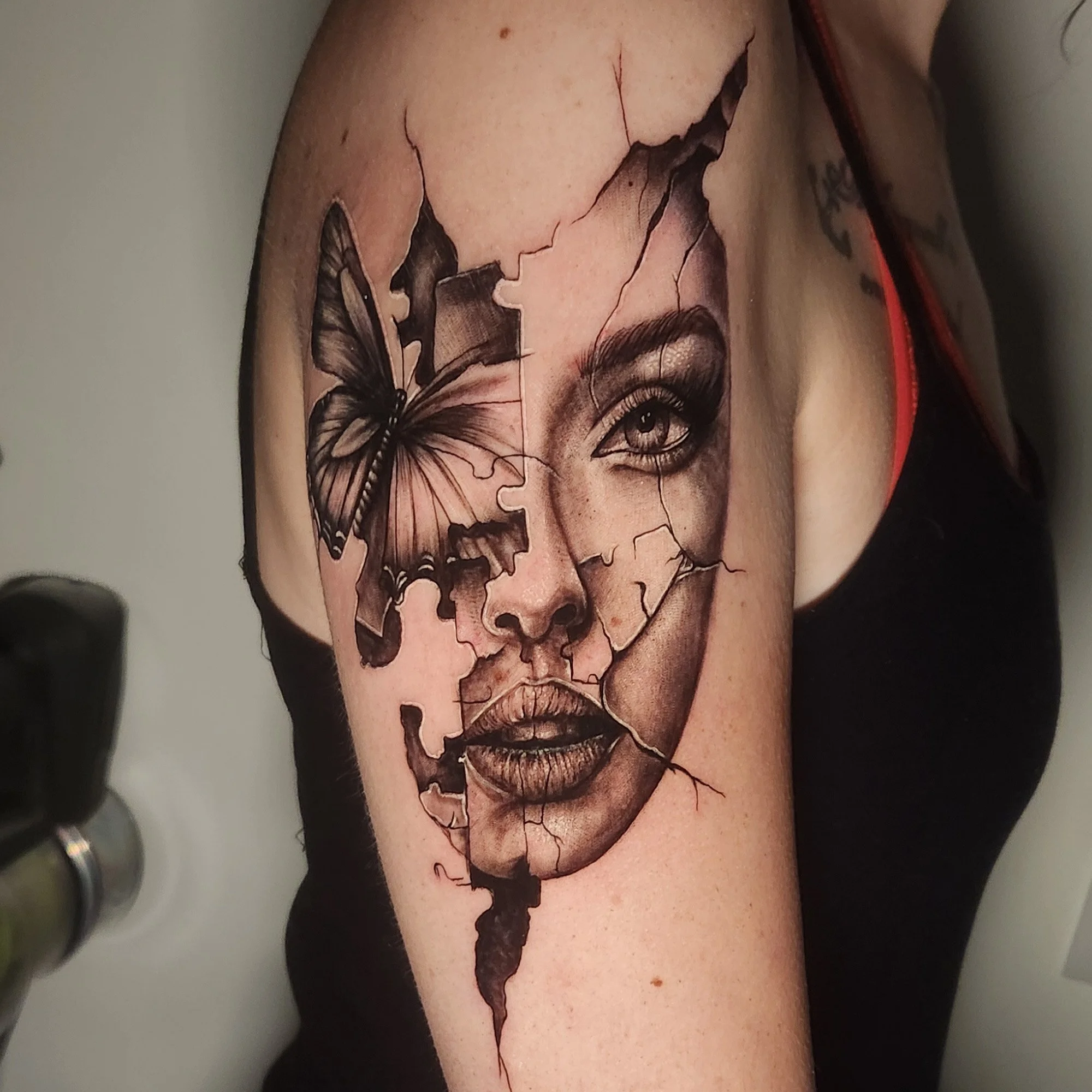 Cracked portrait of woman, realistic with jigsaw pieces and butterfly 