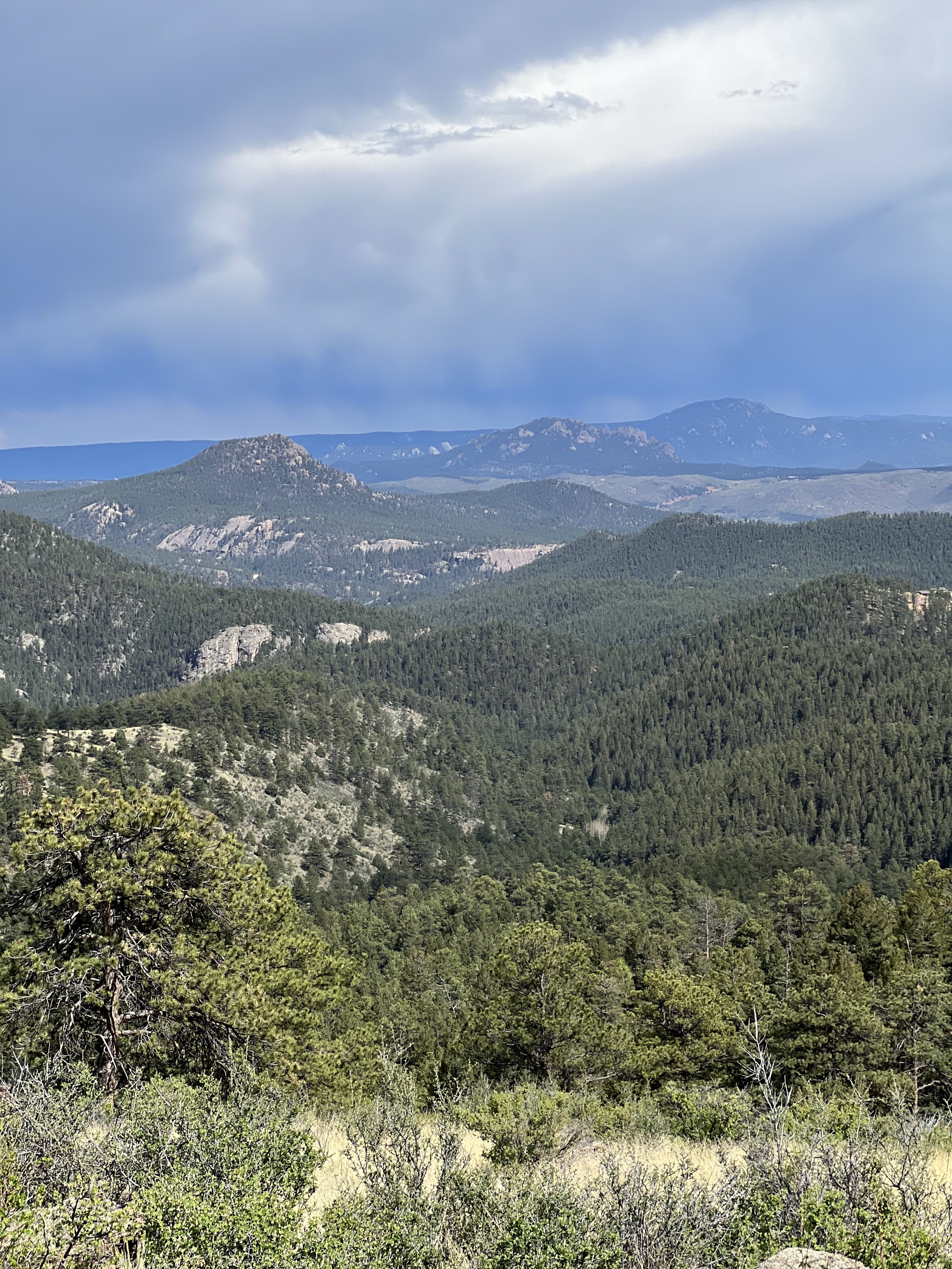 Mountain views from the private hiking trail overlook at Meadow Creek Lodge in Pine, Colorado