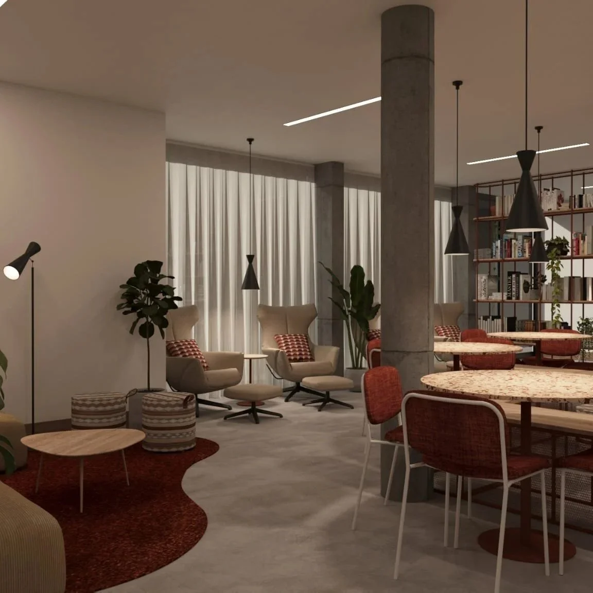Interior view of a modern lounge with beige armchairs, small side tables, red patterned cushions, green plants, round wooden tables with red chairs, a bookshelf with books and decorative items, and pendant lights.