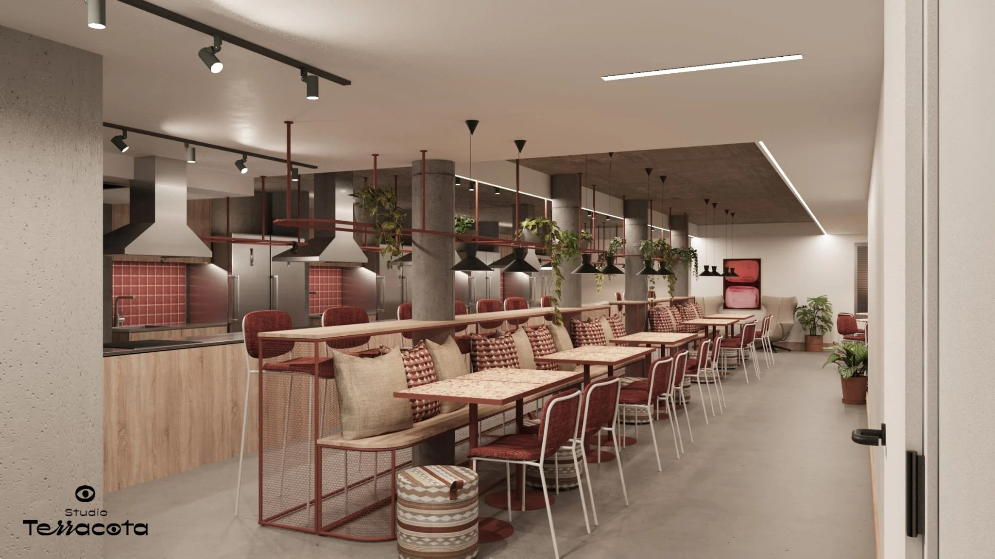 Interior of a modern restaurant with red and beige chairs, wooden tables, black pendant lights, plants, and a kitchen area with red tiled walls in the background.