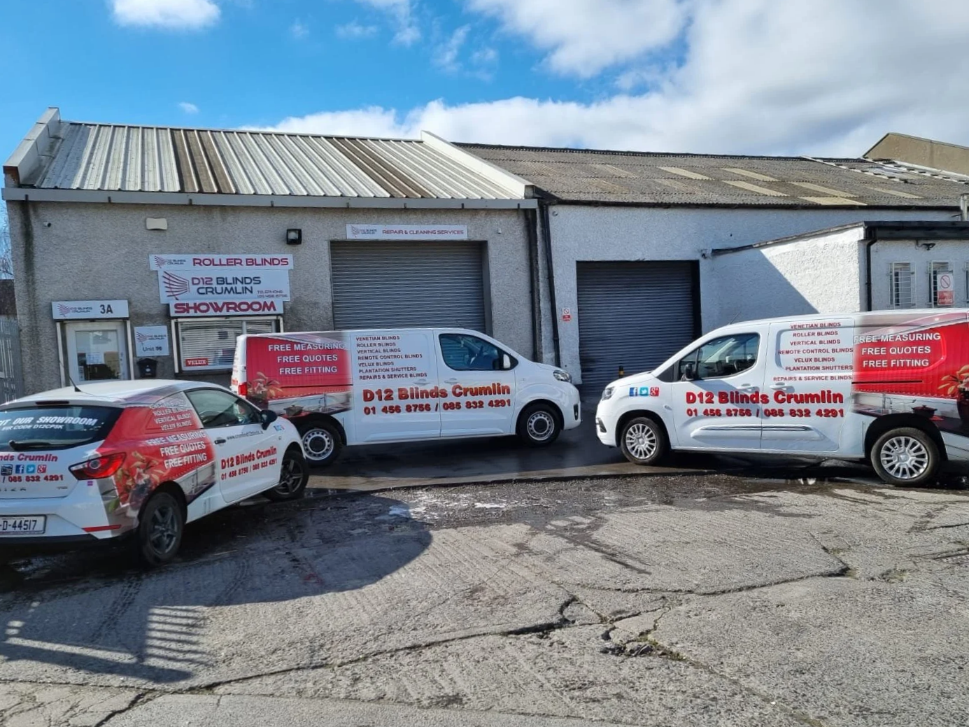 Outside view of a building with a parking lot in front,  parking for D12 Blinds Crumlin Customers, we carry out all services on the premises. The building has a sign indicating it is a showroom for roller blinds, blinds, and curtain services.