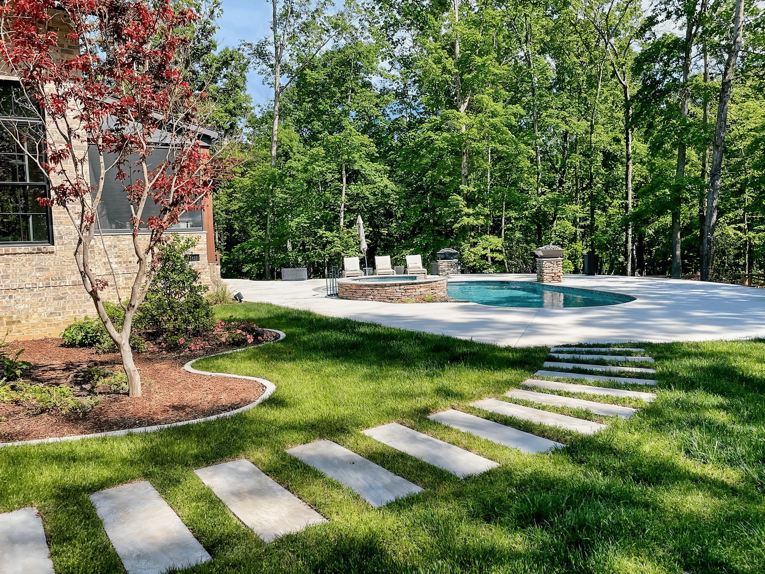 luxury-backyard-pool-landscaping-stepping-stone-path-wooded-yard-tennessee.jpg