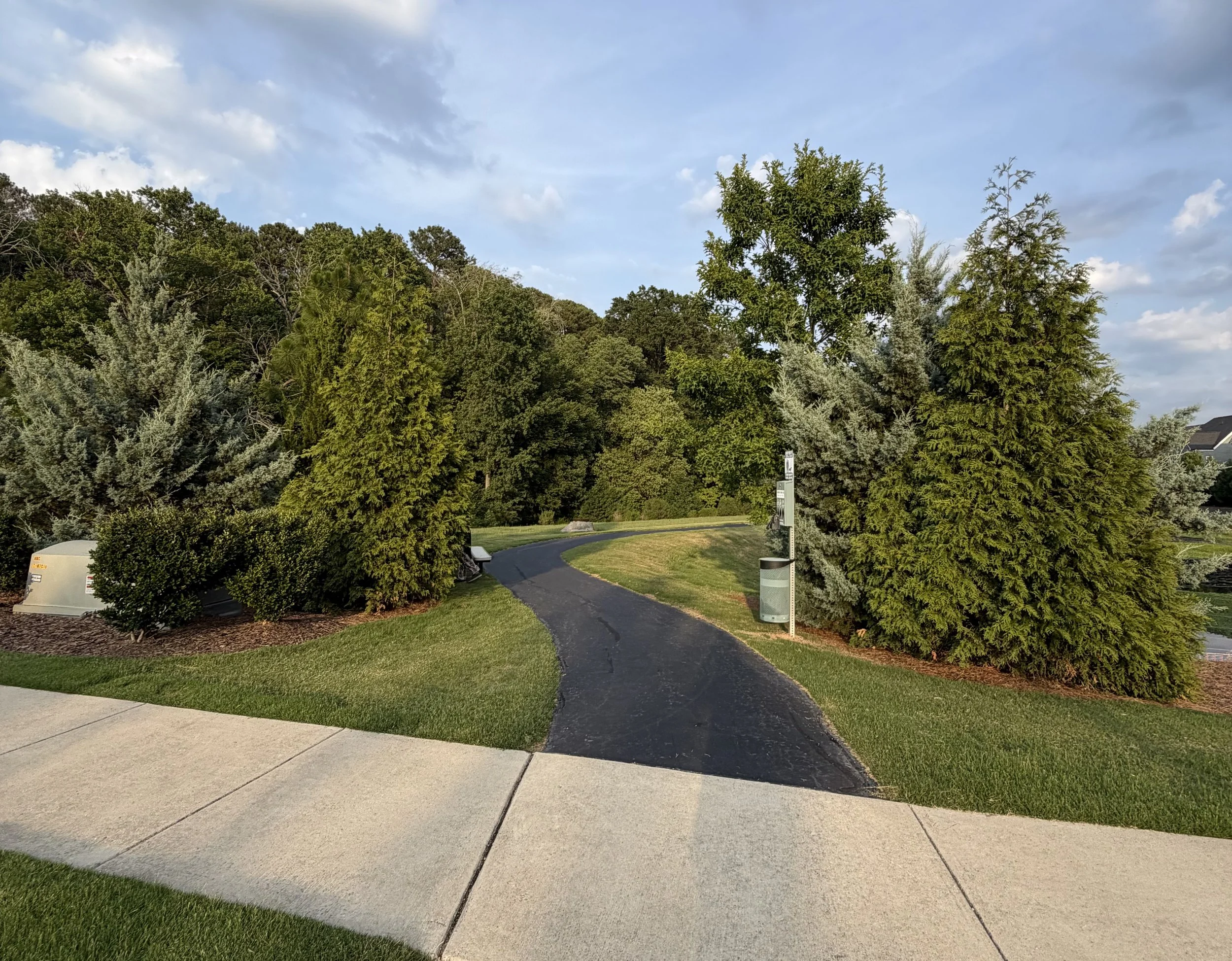 Cary neighborhood greenway with a paved path and surrounding trees