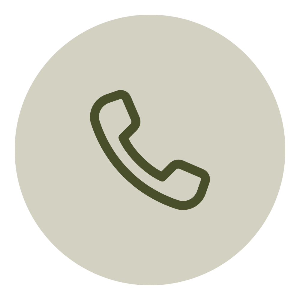 Icon of a telephone handset inside a circular background.