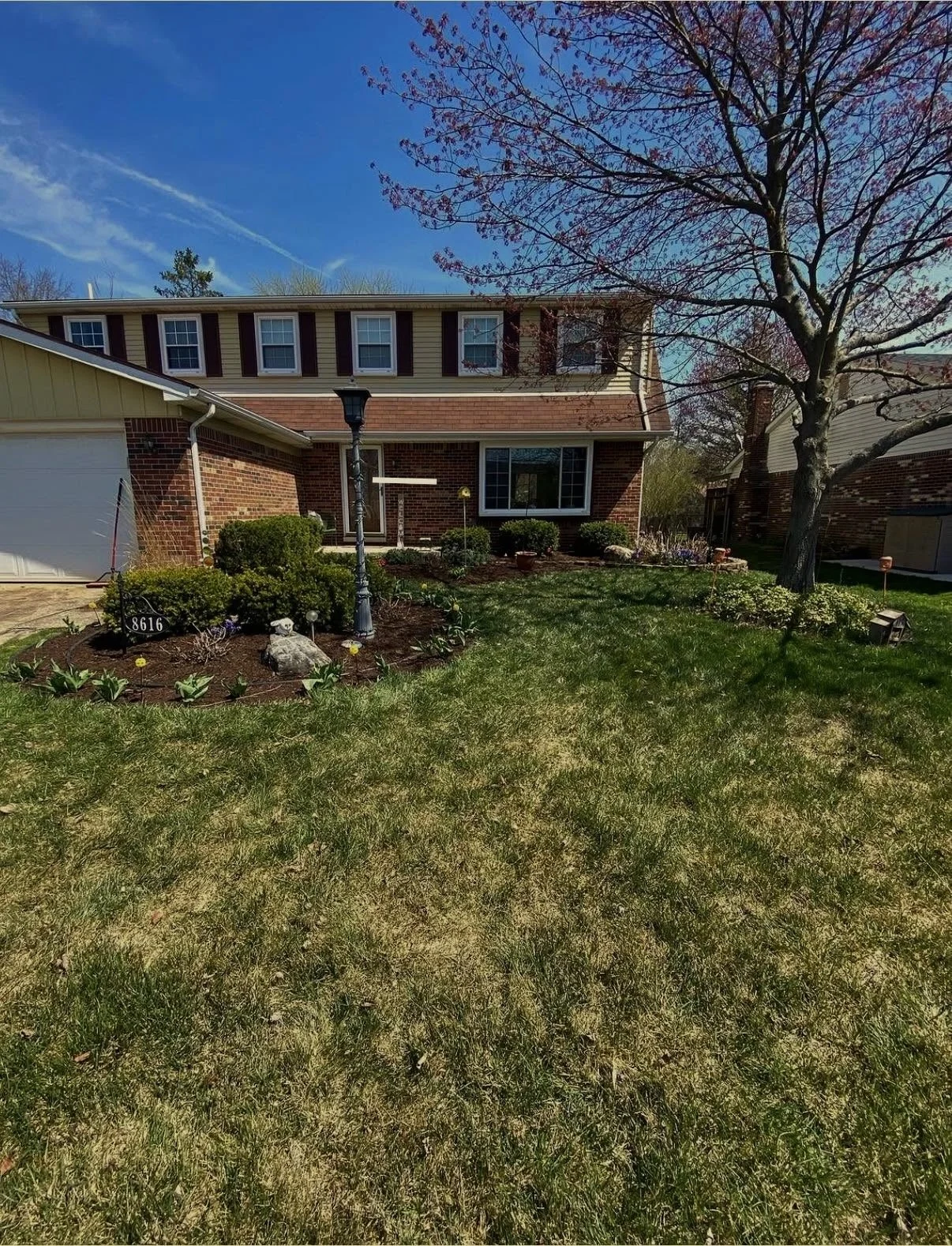much refresh on a suburban brown home. beautiful landscape design ideas.