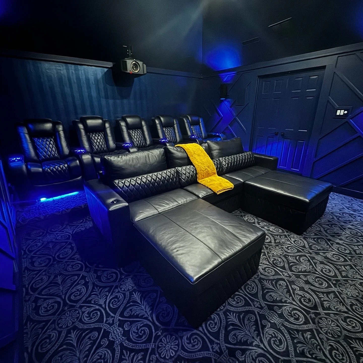 Let Custom Theater Solutions transform your space with our full theater room buildout! 

🎬✨ Check out this stunning setup featuring Control 4 Automation, Lutron Lighting control , custom wood accent wall, snake skin wallpaper, custom theater carpet,