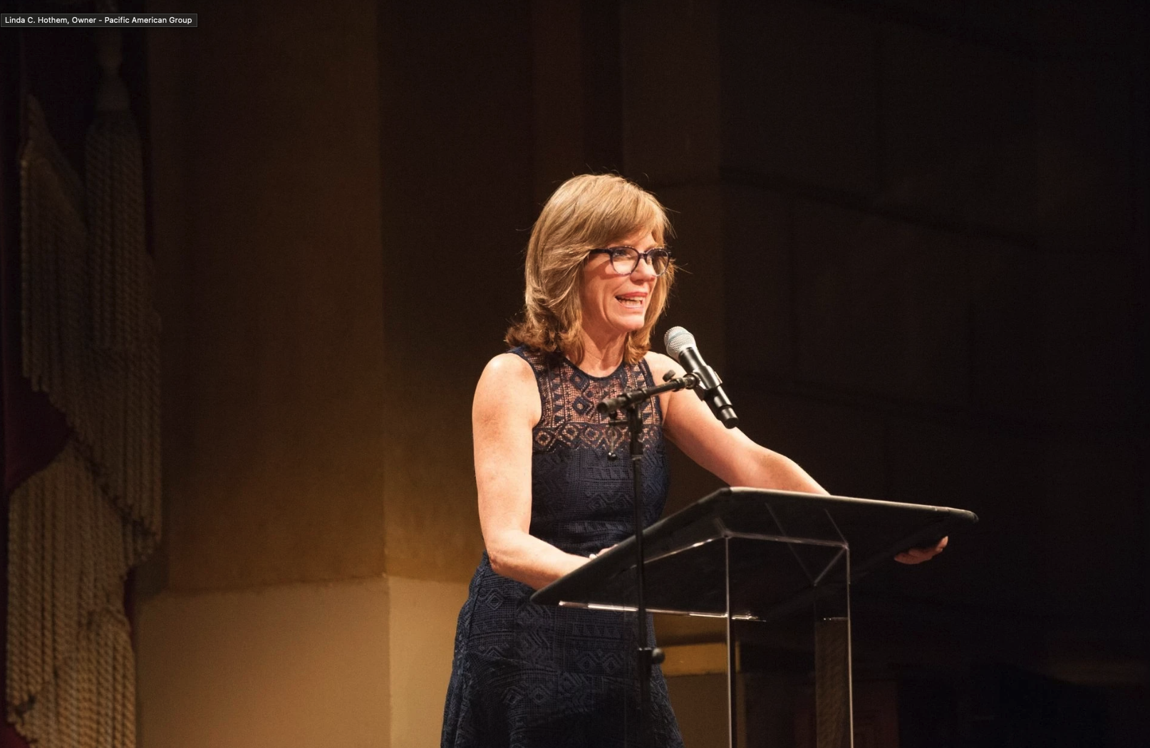 Pacific American Group CEO, Linda Hothem at podium.