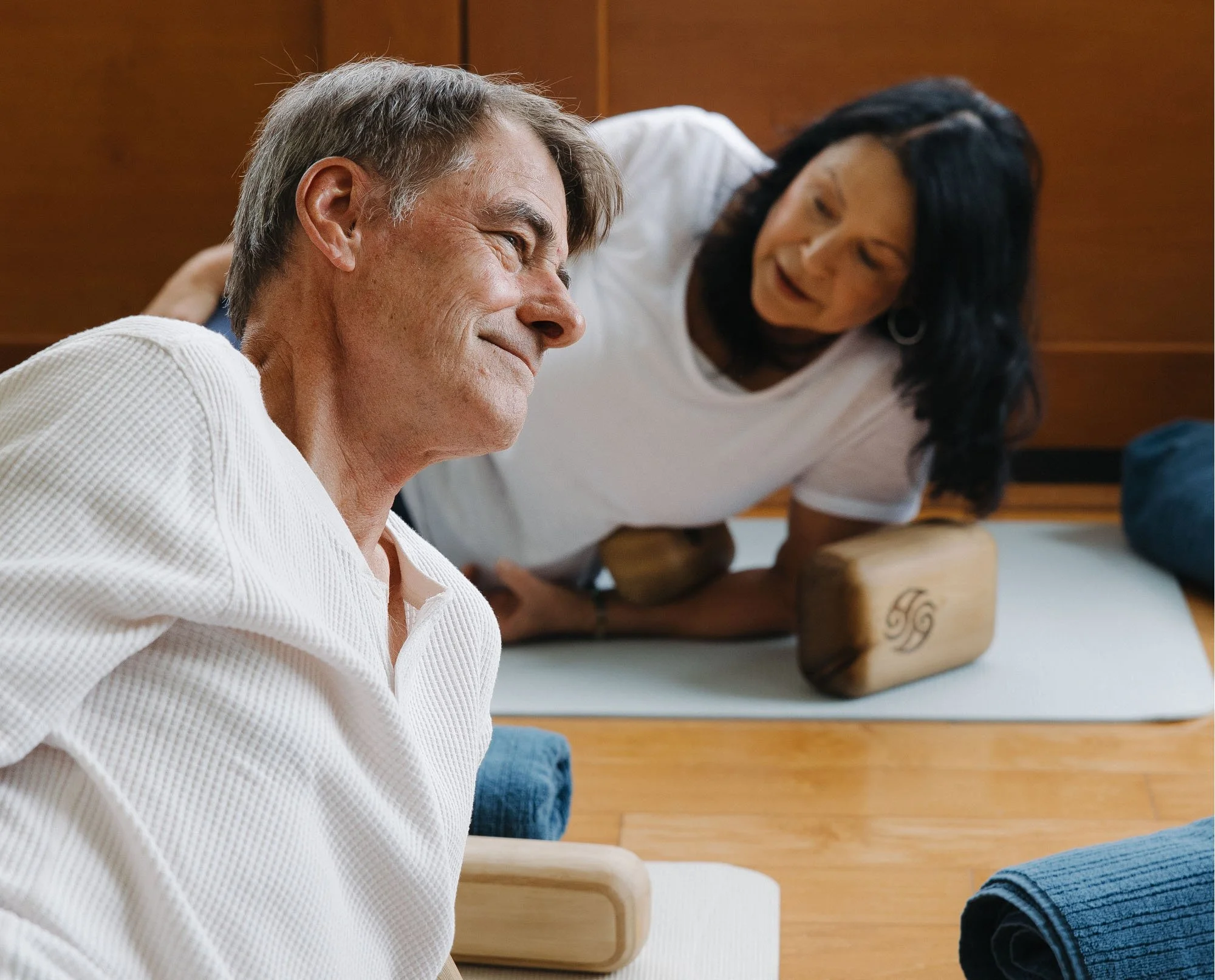 Students practicing supported Block Therapy positions during a guided fascia release class in Summerland, BC.