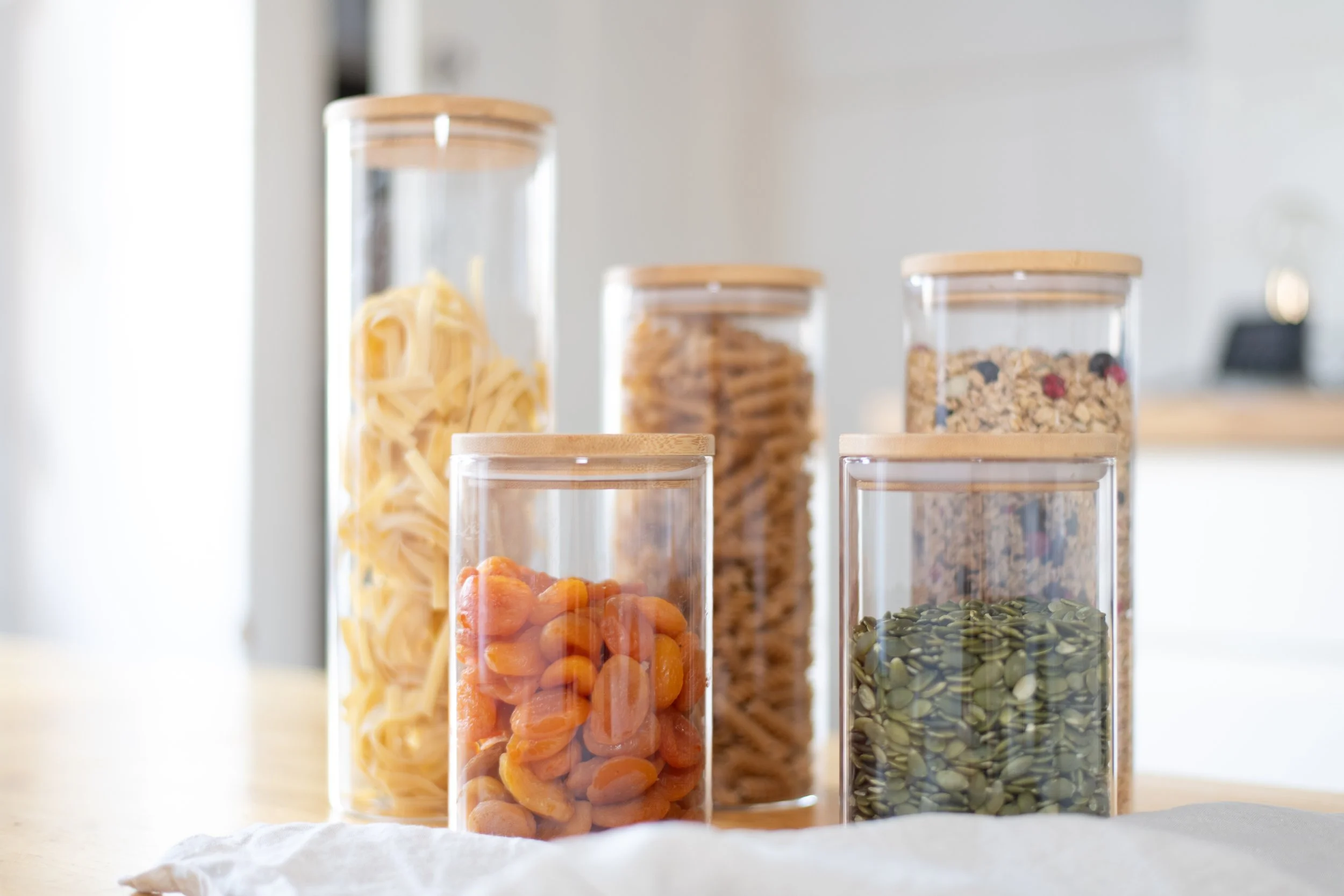 Organised pantry storage using clear containers to create a tidy and functional kitchen.
