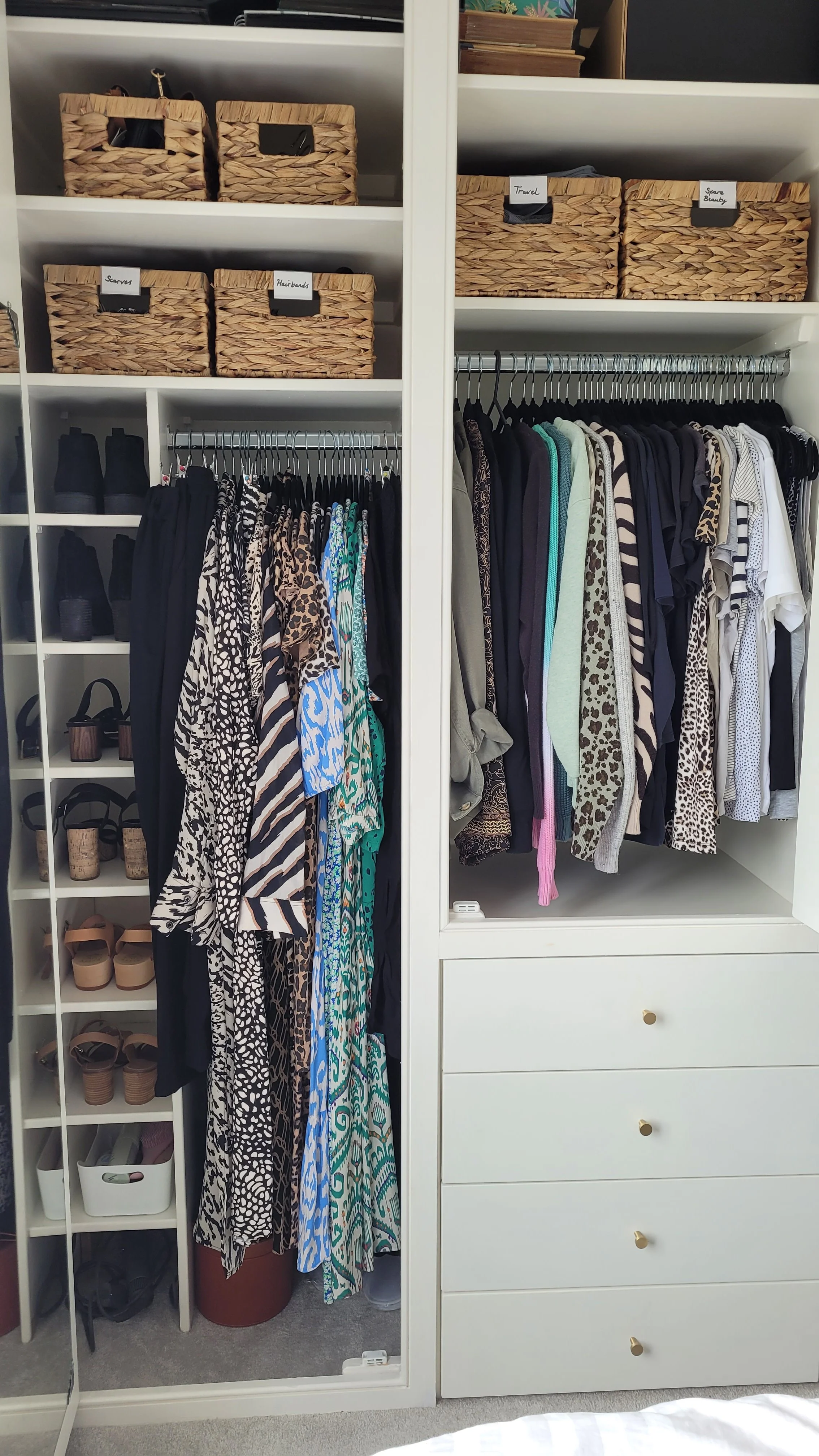 Professionally organised wardrobe with practical clothing storage and easy-to-maintain systems.