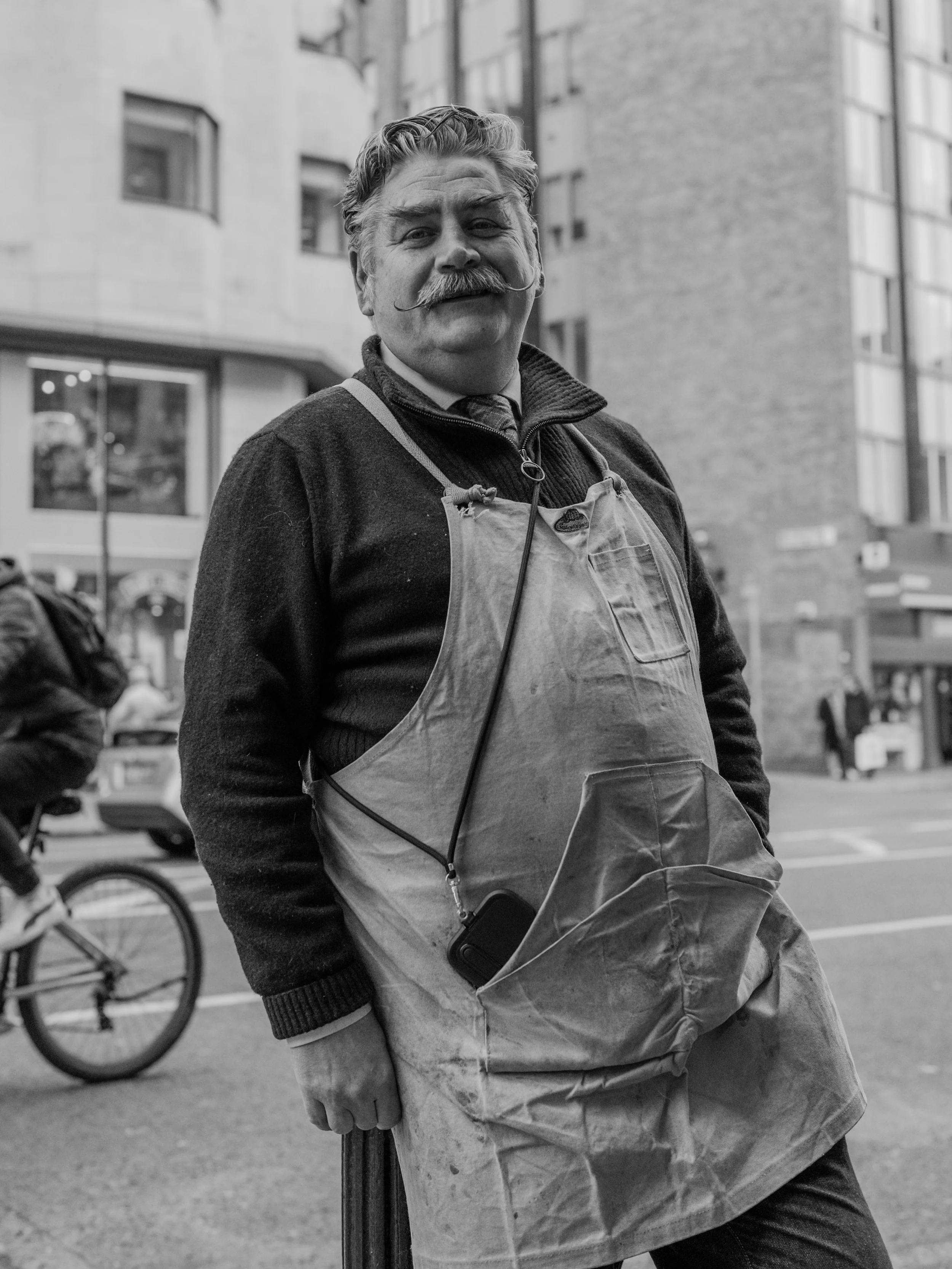 Old fashioned stylish cobbler man with moustache in Dublin