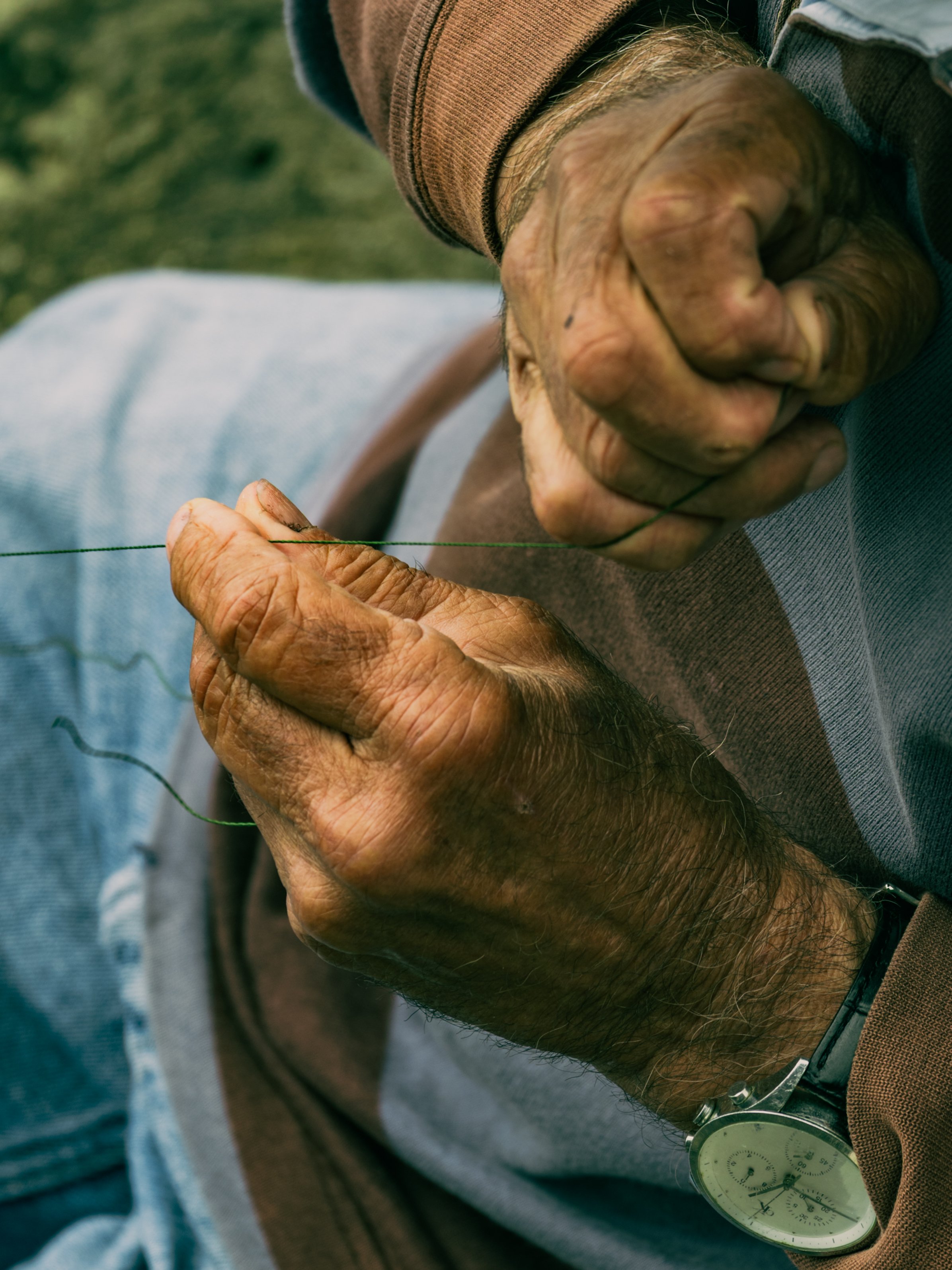 Fisherman's hands preparing his tackle