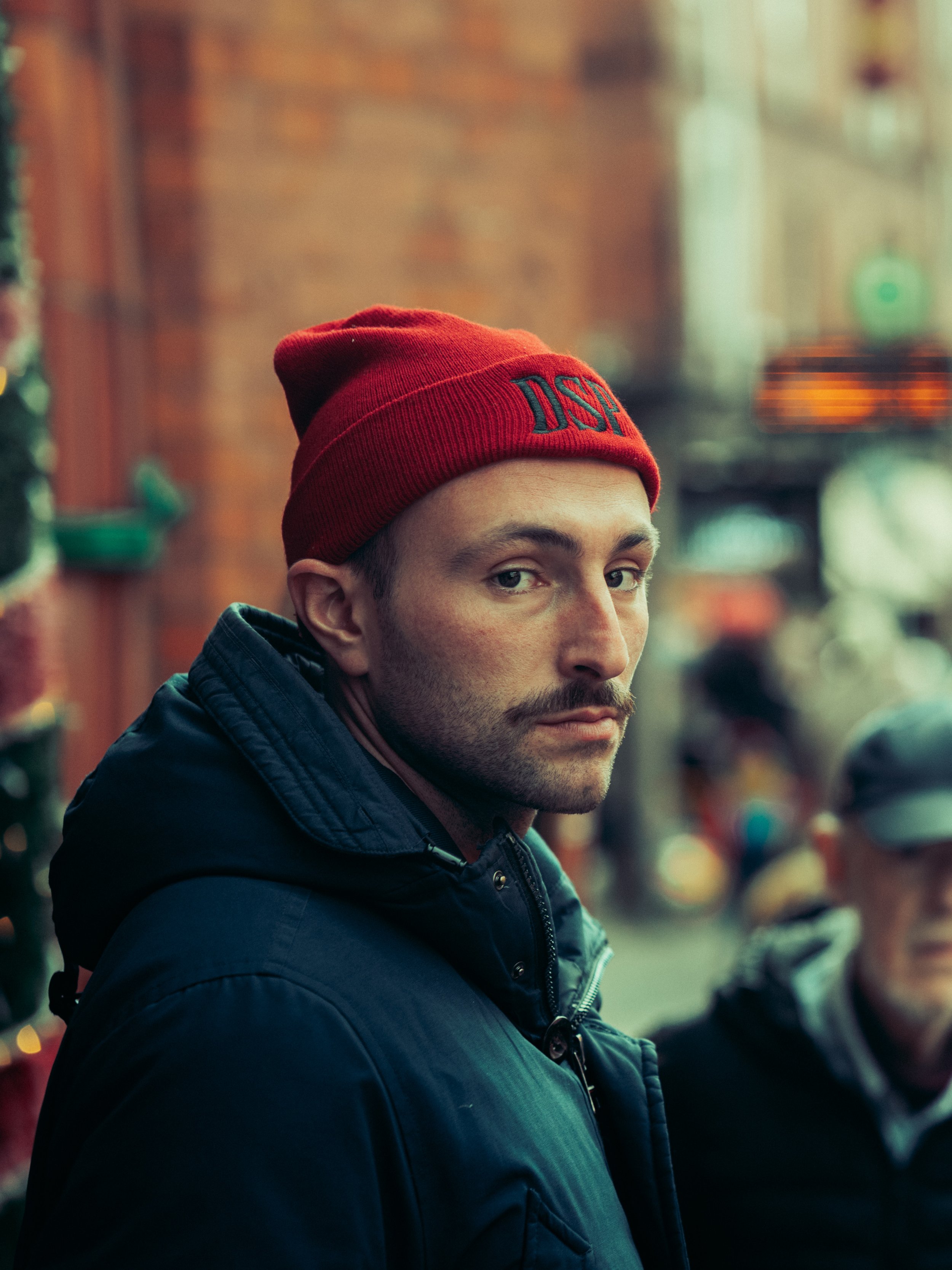 Portrait of man in red hat in Dublin