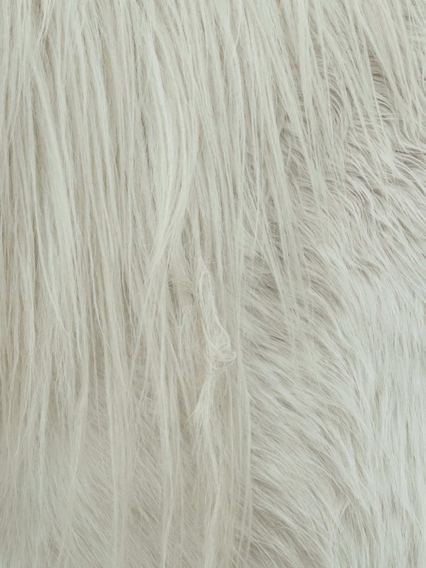 Close-up of white, fluffy fur with long, fine strands.