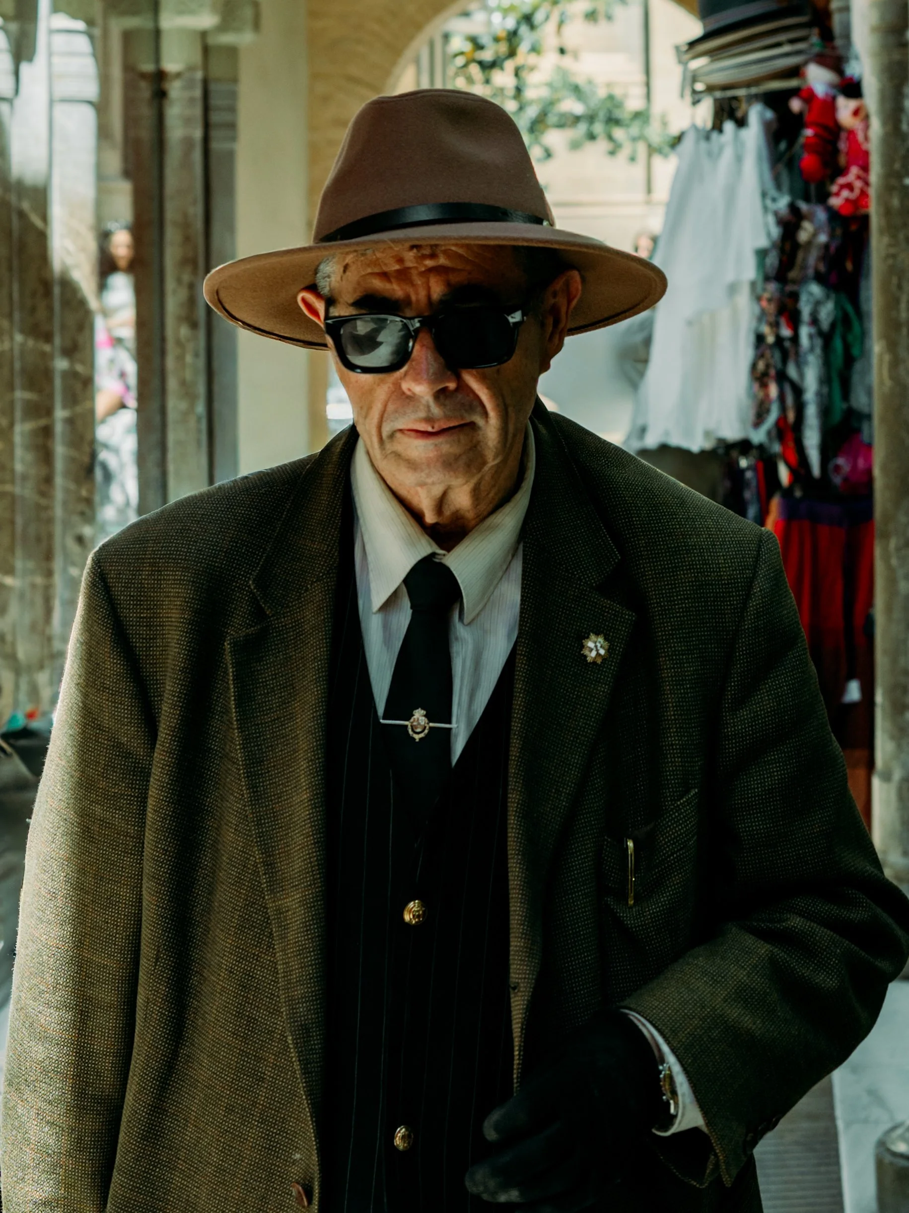 Dapper man dressed like an old school Italian mafia man