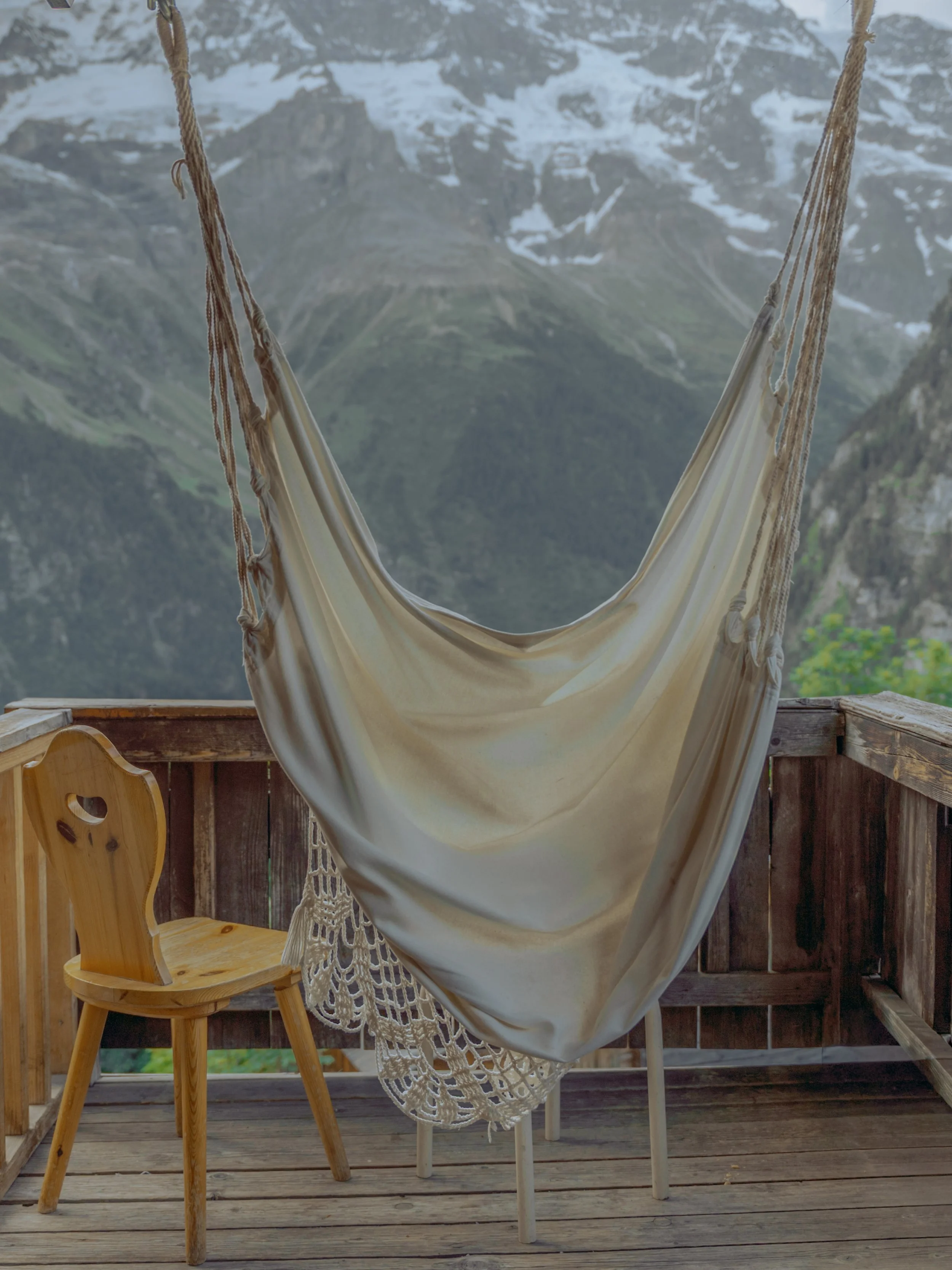 Alps Switzerland Balcony view to mountain with chair and hammock Interior Photography Architecture 