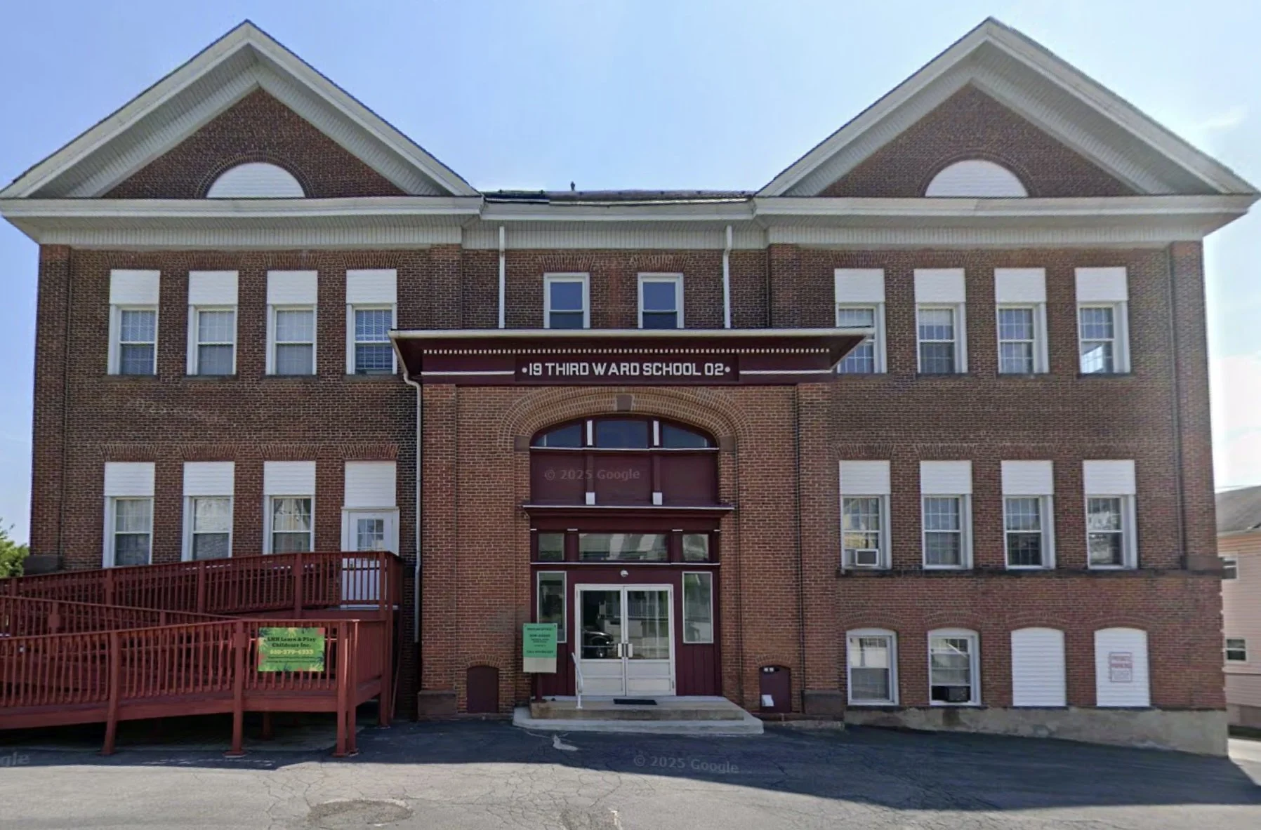 A Google Streets view of the old two story red brick school building at 355 n 3rd st.  Text over double front doors reads Third Ward School.  There is a wooden access ramp on the left side.