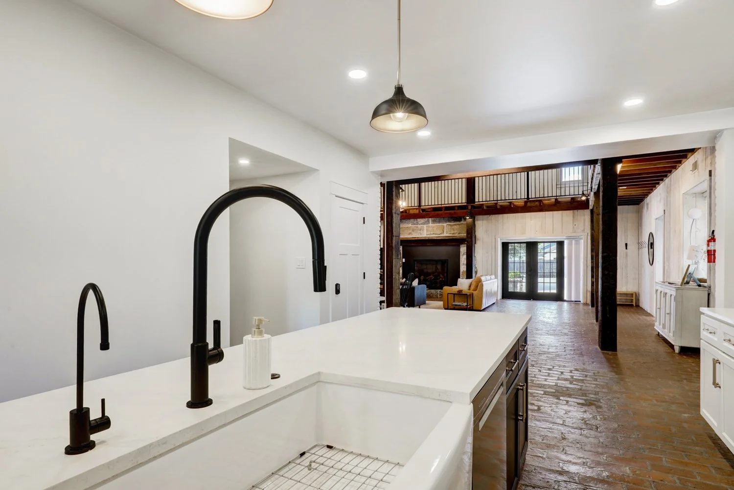 View of the great room and fireplace from the kitchen