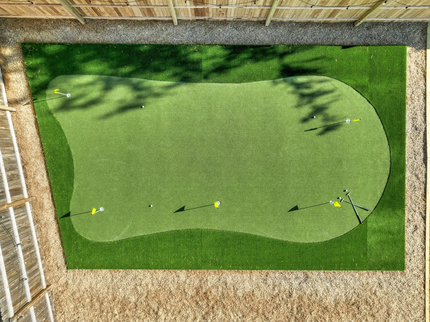 Putting green in shared yard, golf balls and putters provided. 