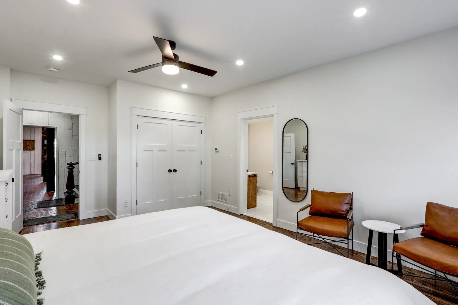 Primary bedroom with a king bed on the first floor of The Barn. No steps or stairs required to access this bedroom from the parking lot. 