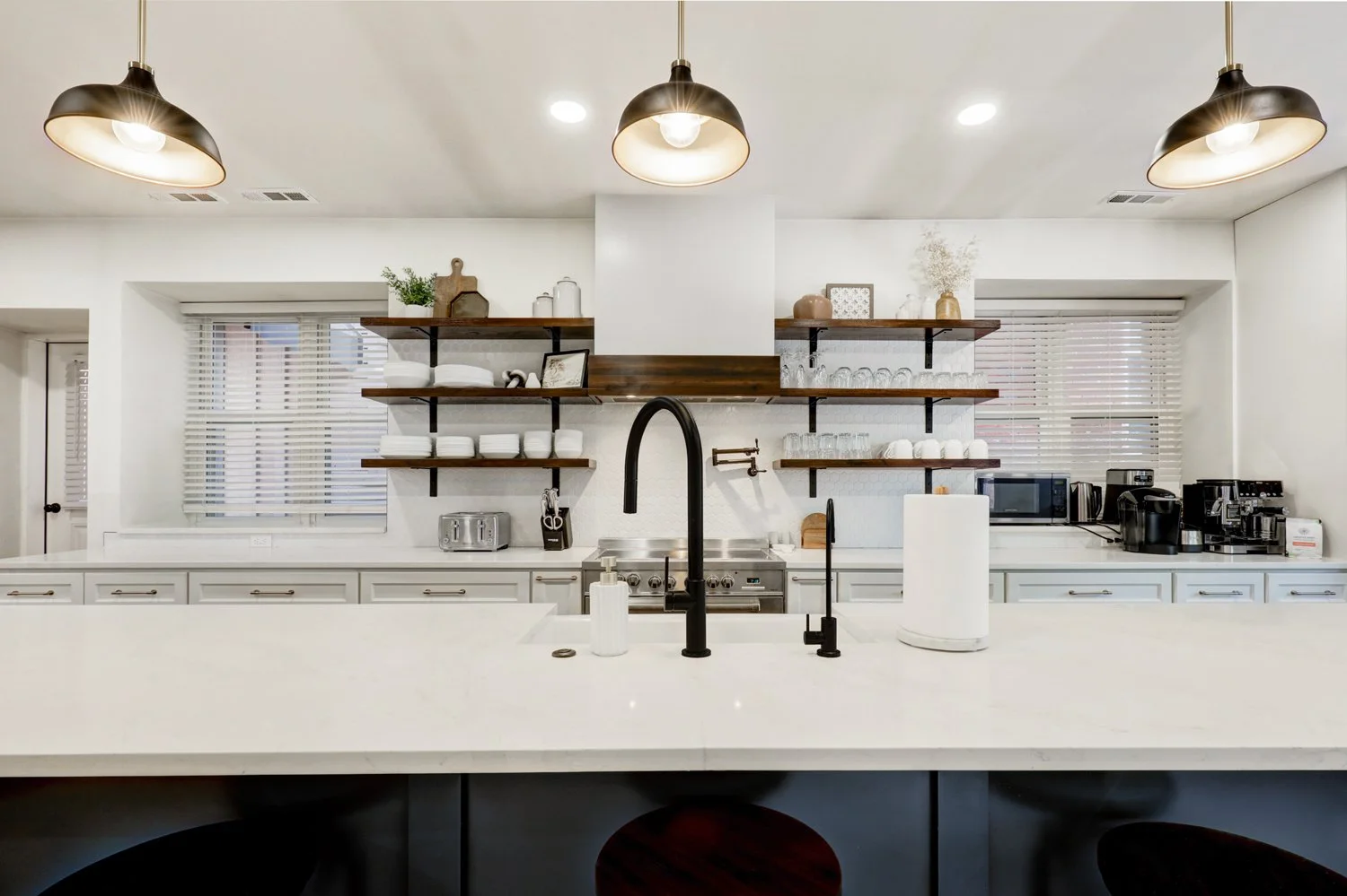 Fully stocked kitchen with cooking essentials. Handheld mixer, Ninja blender, air fryer, waffle maker, electric griddle, & panini press available to use.