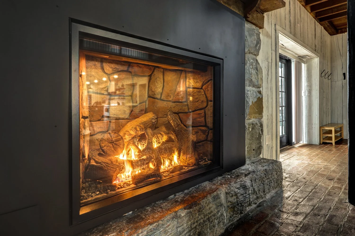 Propane fueled fireplace, main entry door is to the right 