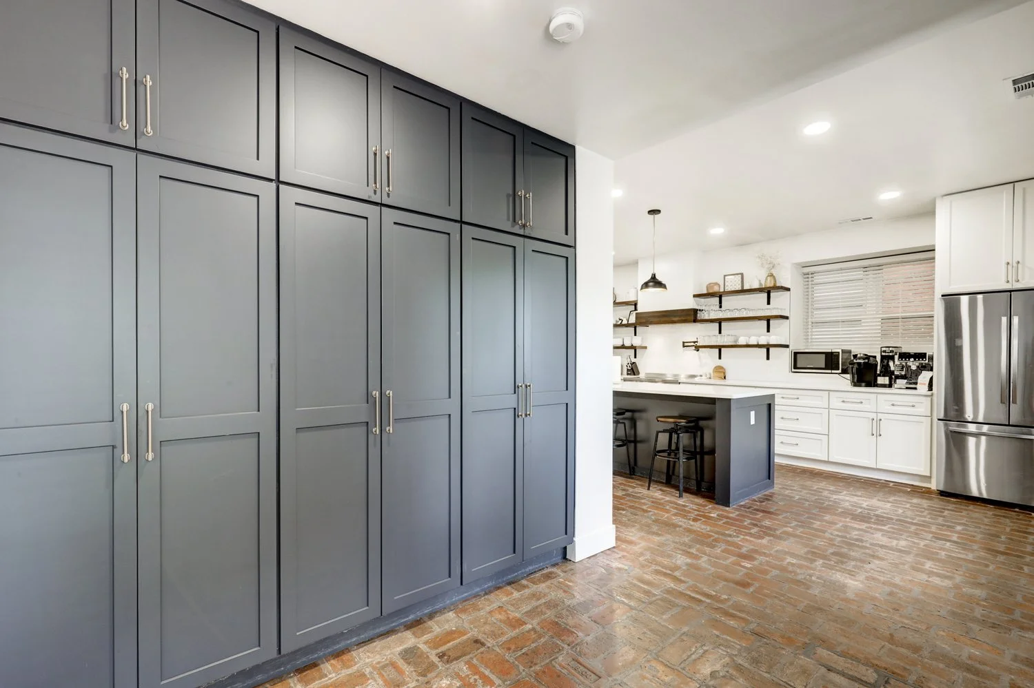 Pantry area off the kitchen. Waffle maker, panini press, air fryer, and electric griddle are stored here. 