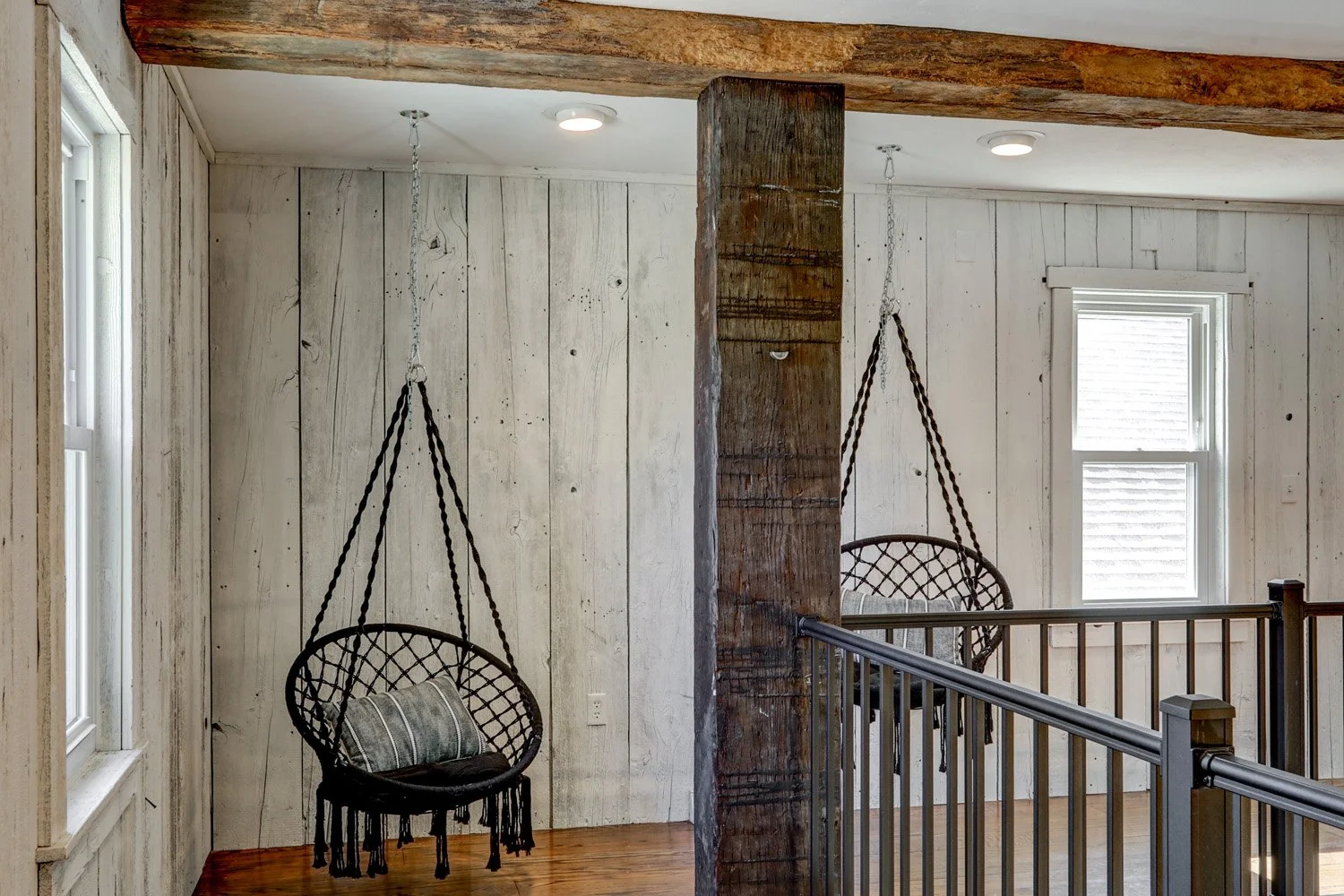Hanging chairs on the second-floor balcony