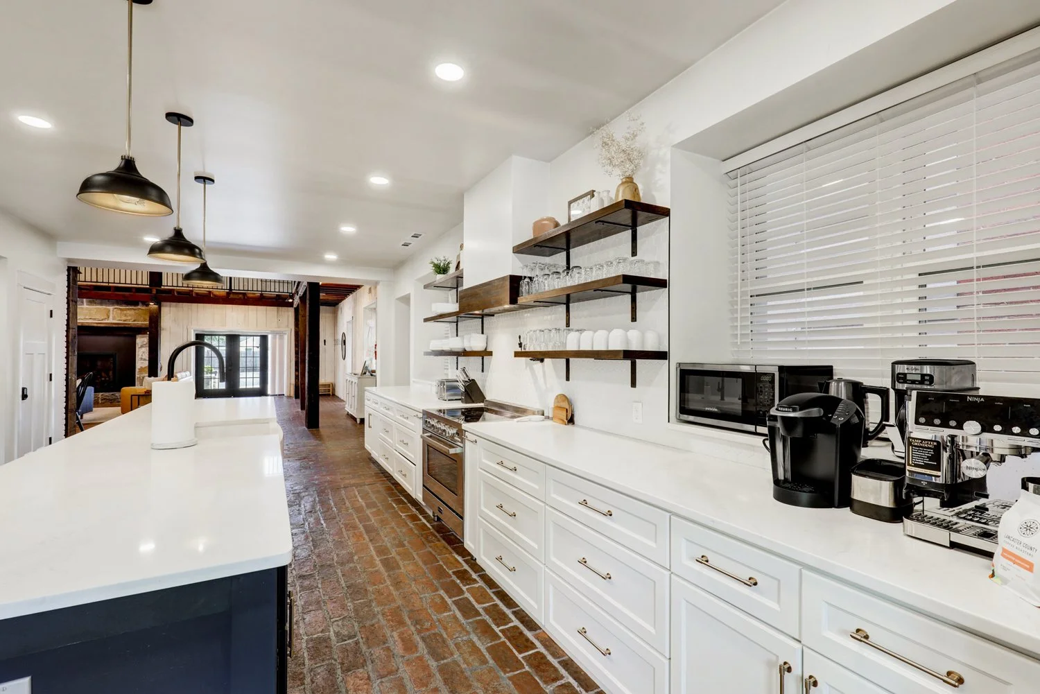 Fully stocked kitchen with Ninja Luxe espresso machine(locally sourced espresso beans provided), Keurig & drip coffee maker, tea kettle, and French press(ground coffee not provided) 