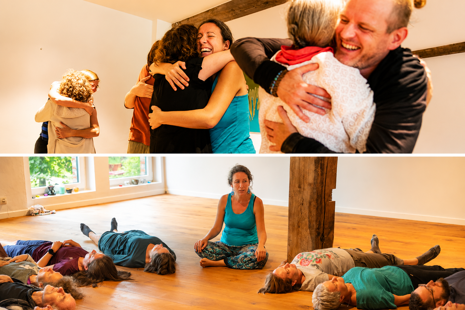 Group of people hugging and smiling in a happy gathering, some lying on the floor and others sitting in a yoga or meditation space with wooden floors and large windows.