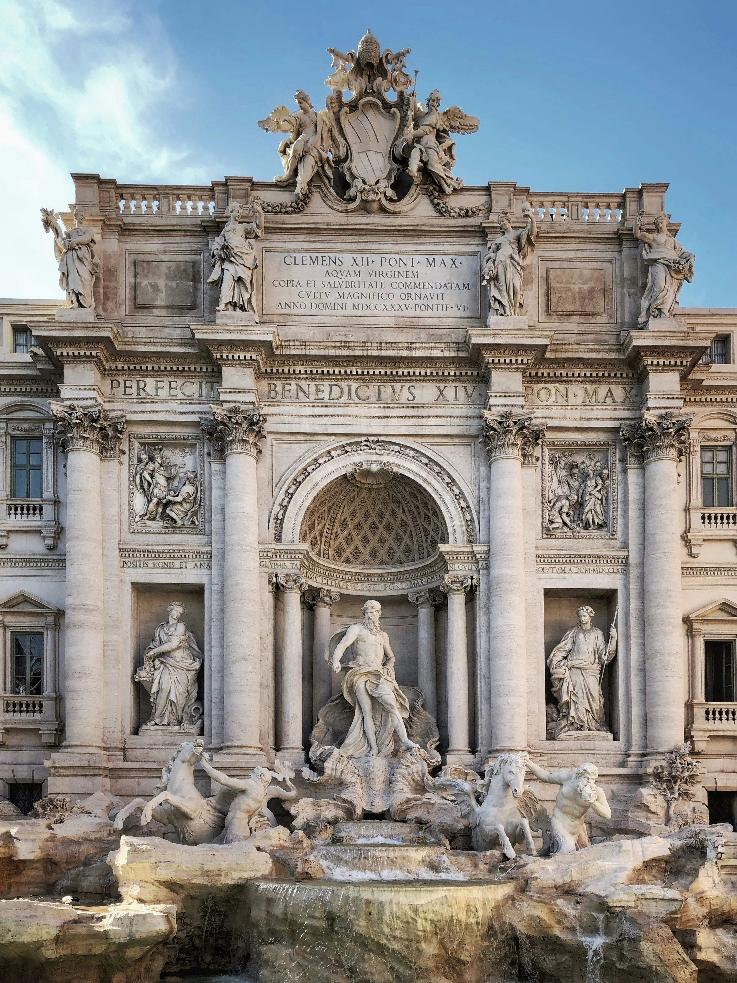 Famous Trevi Fountain with elaborate sculptures and cascading water in Rome, Italy.