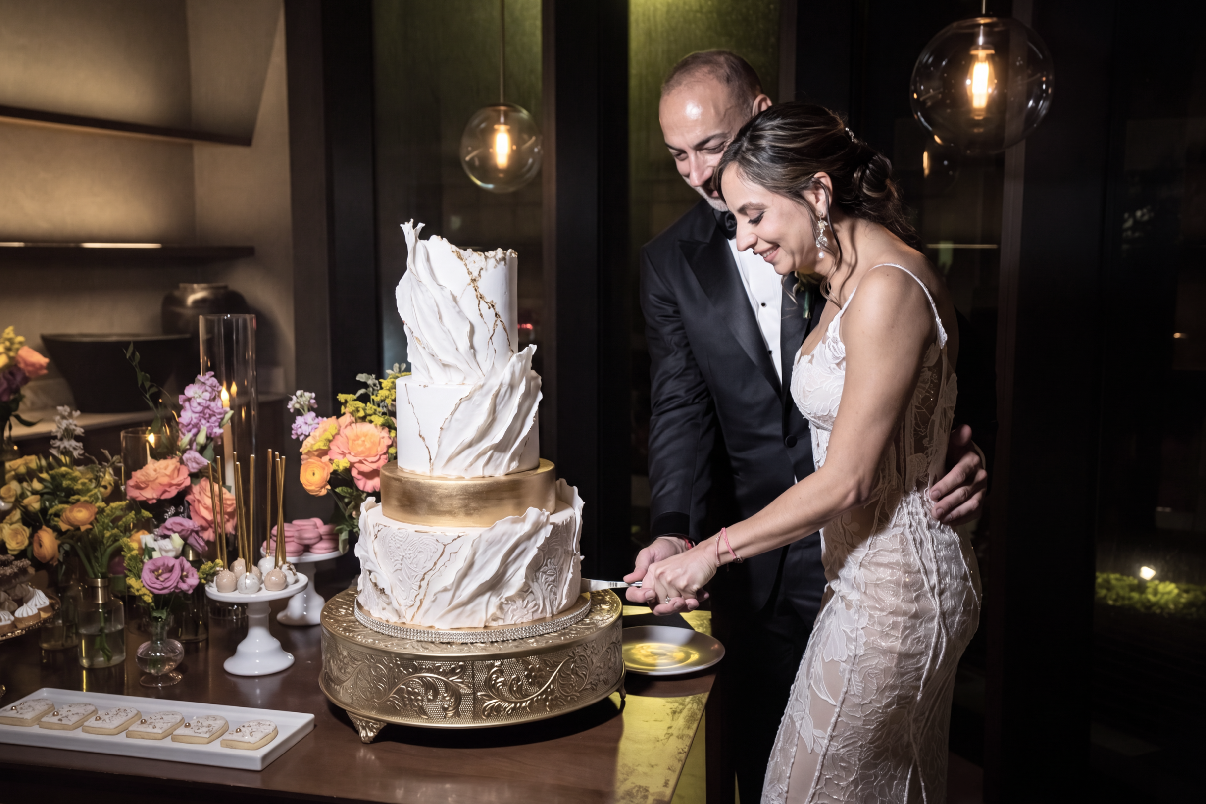 Chef Indira with her husband cutting a slice of the Cake on their wedding.