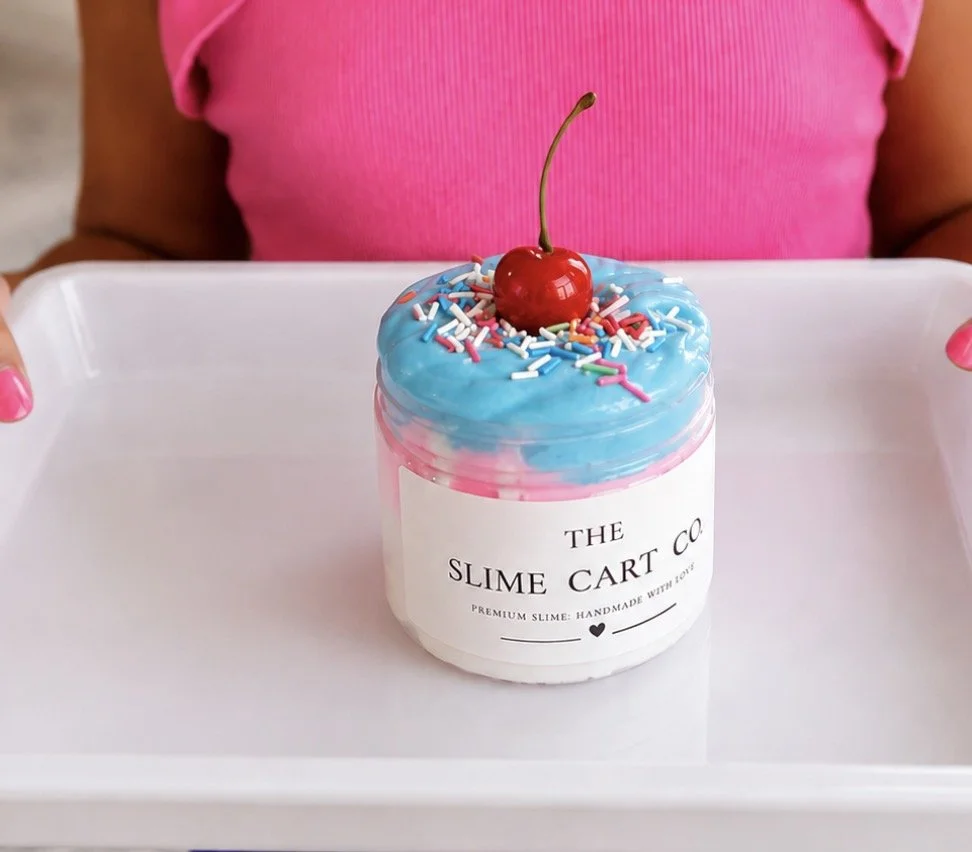 A colorful slime creation topped with sprinkles and mix-ins.