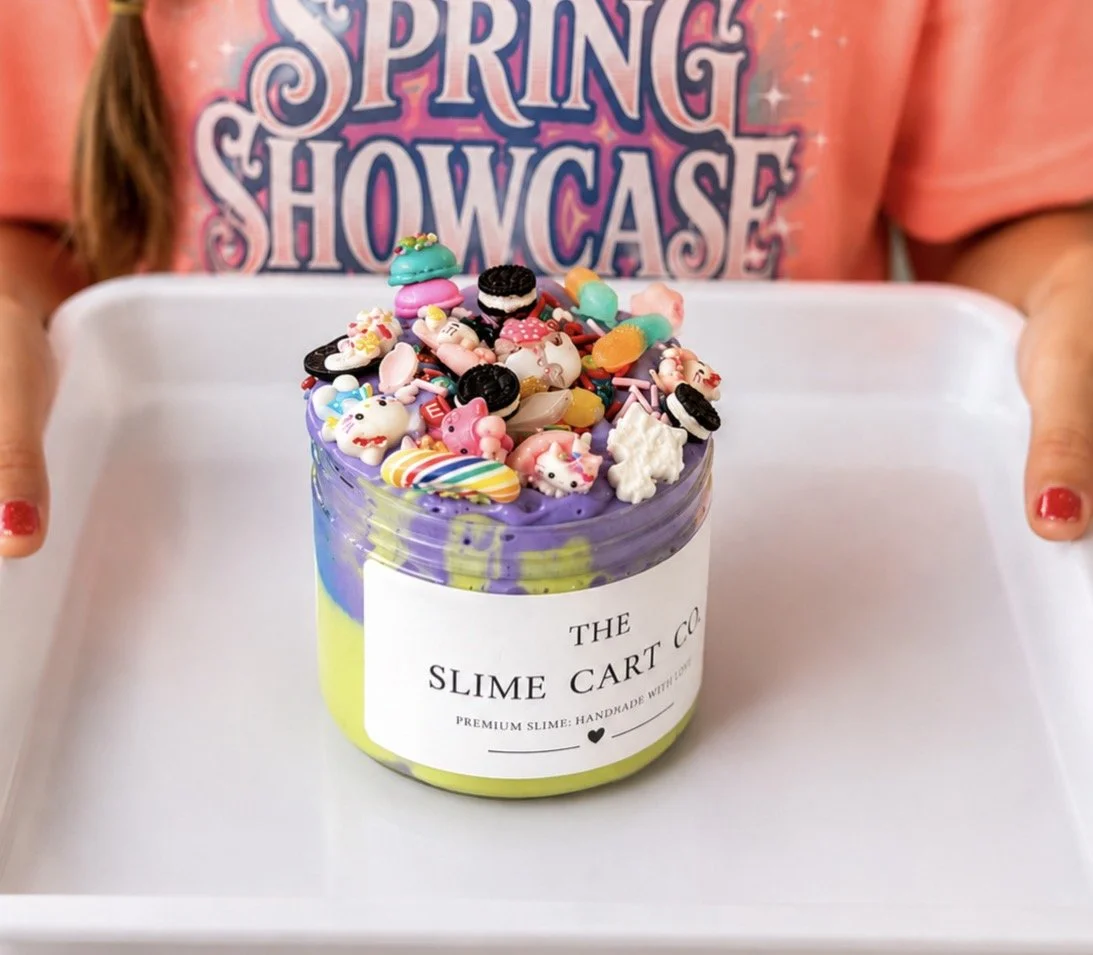 A child holding a colorful slime creation from a birthday event.