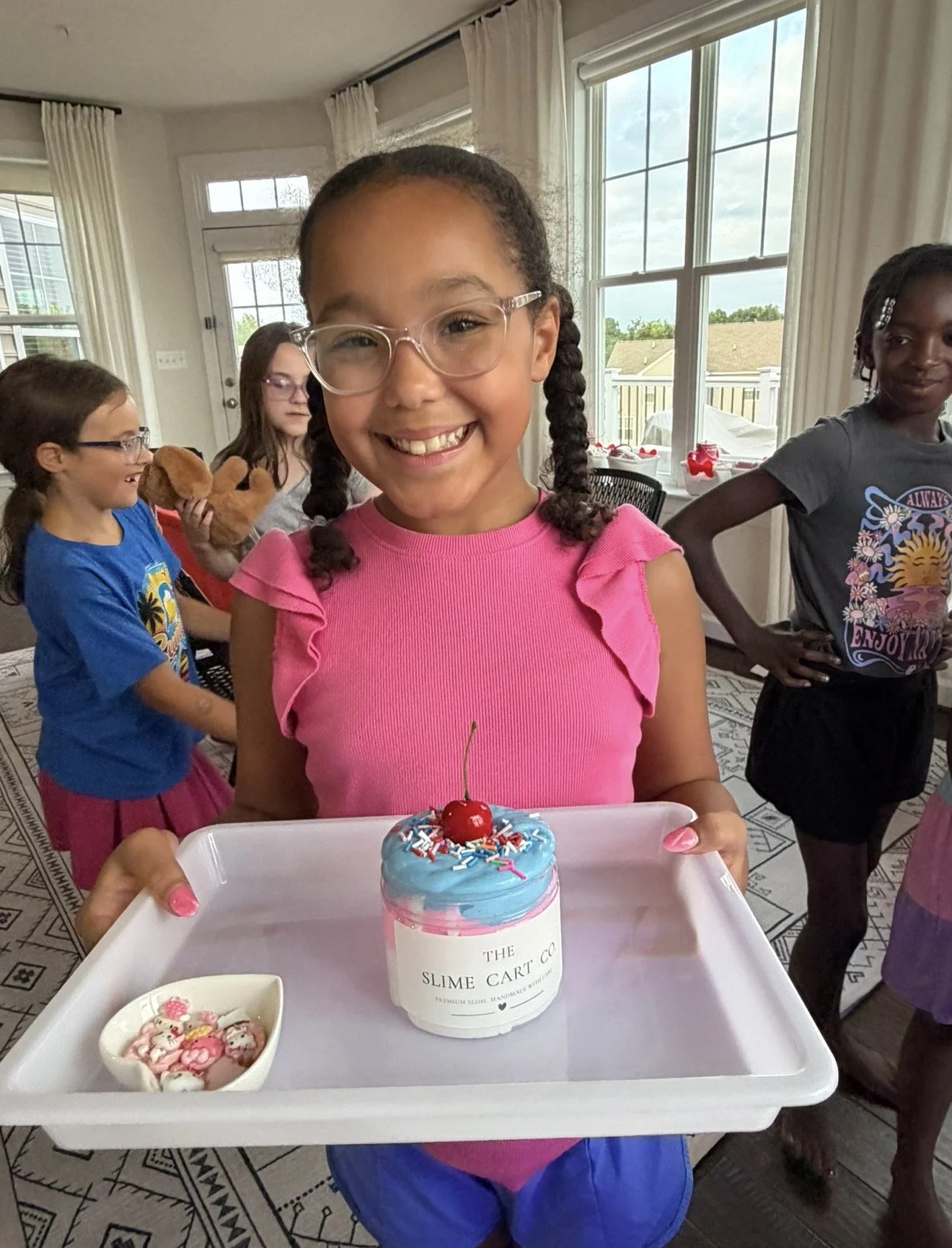 A child holding a custom slime creation