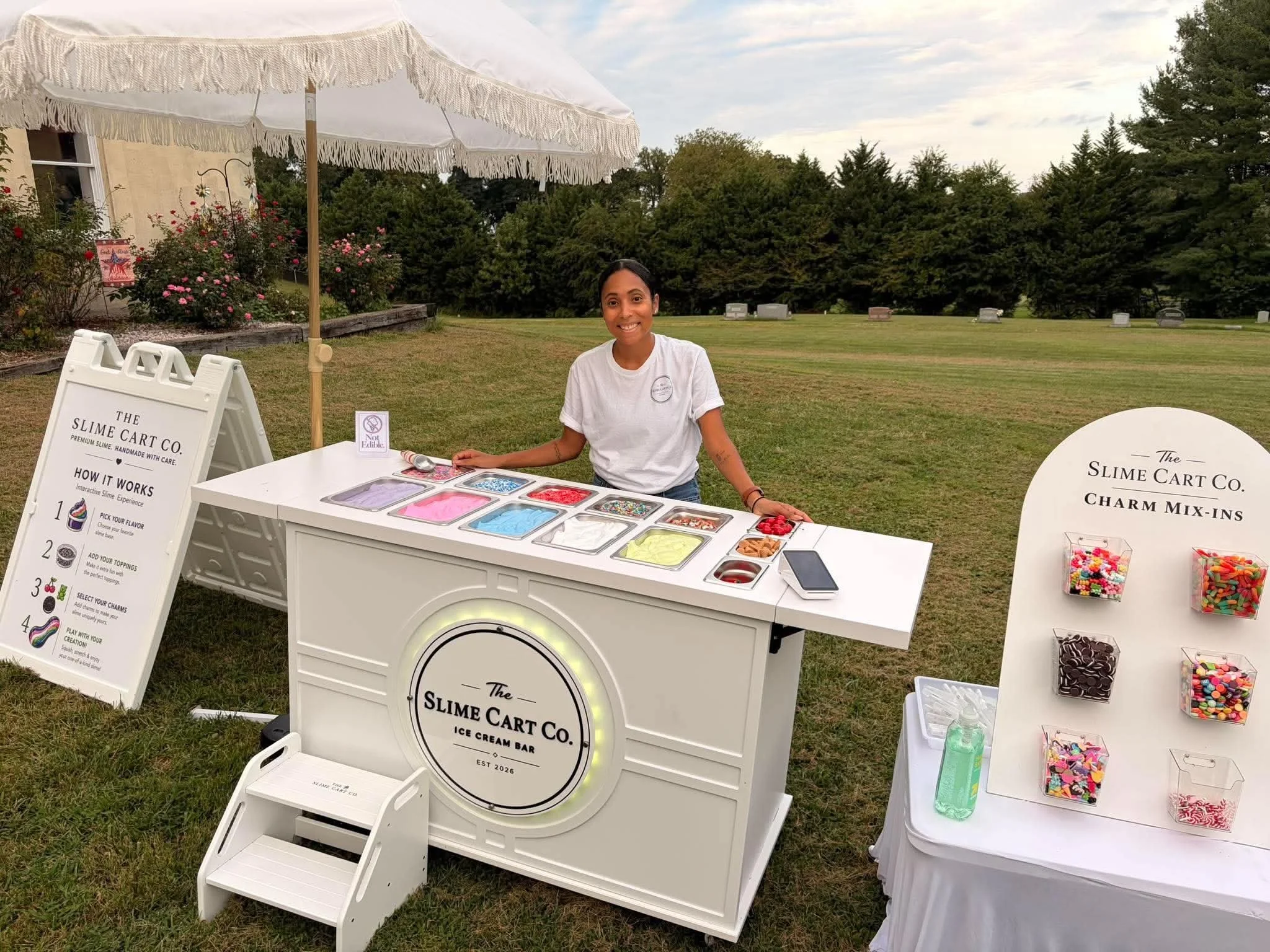 The Slime Cart Co. cart set up for an event outside on grass