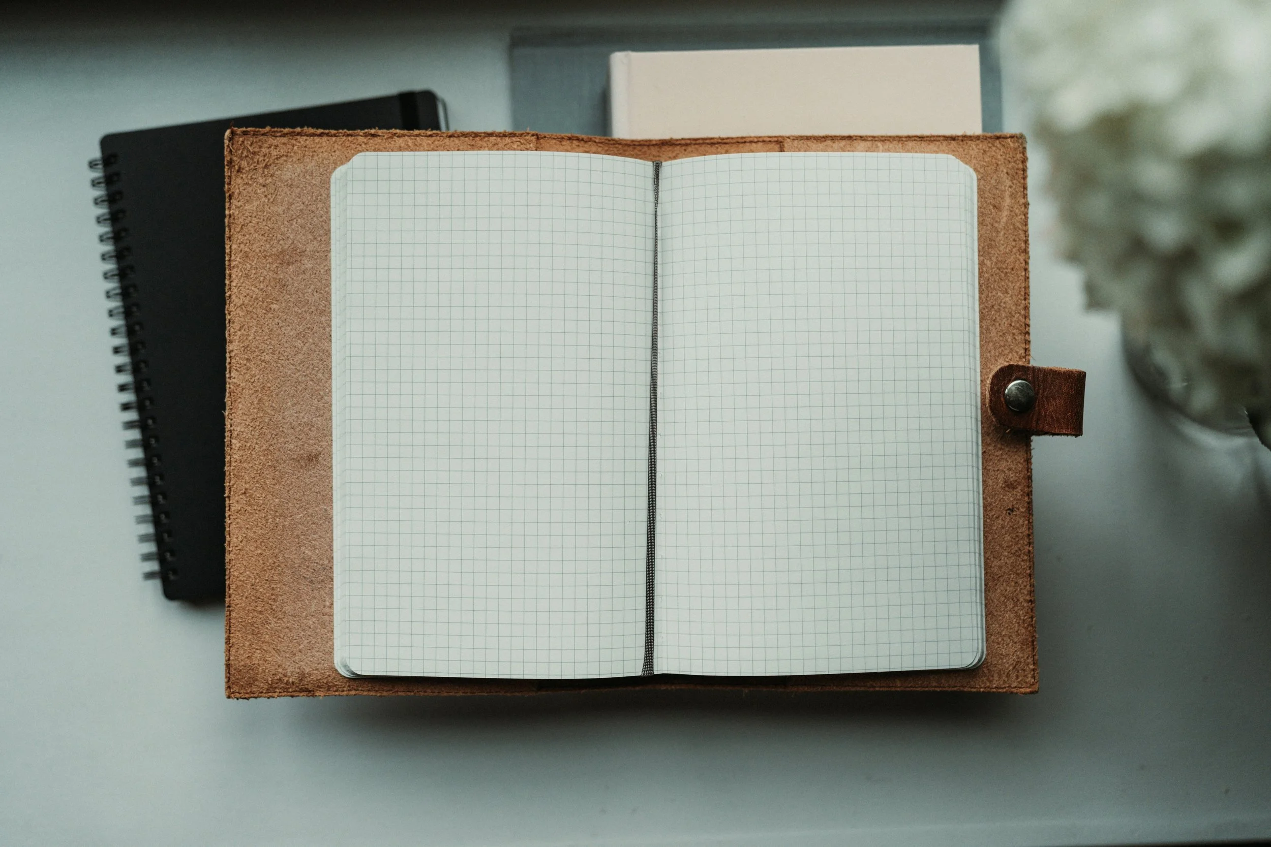 Empty notebook representing how to do a mindfulness exercise on whether getting a bonus will help your emotions