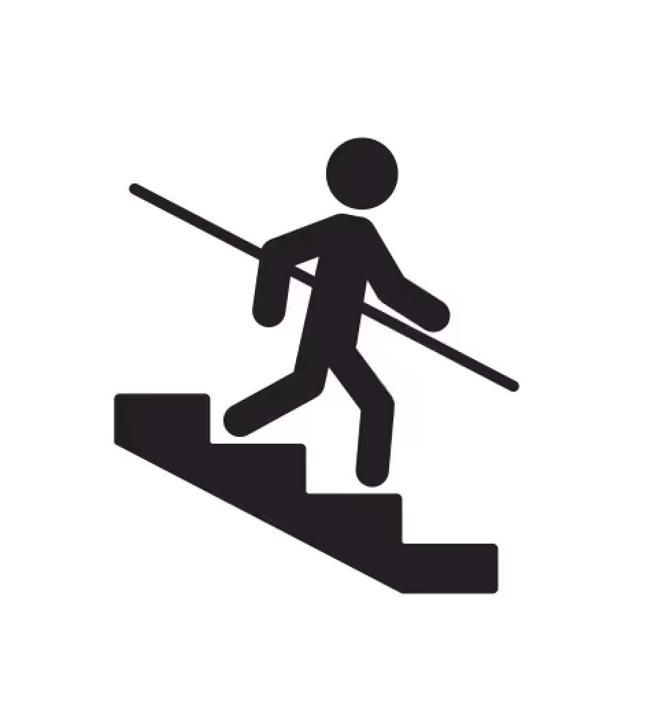 Silhouette of a person walking down stairs while carrying a pole.